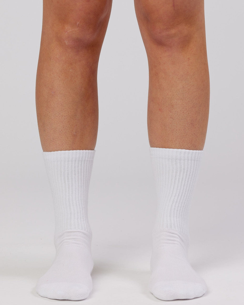 Model wearing Essential 3 Pack Crew Sock - White