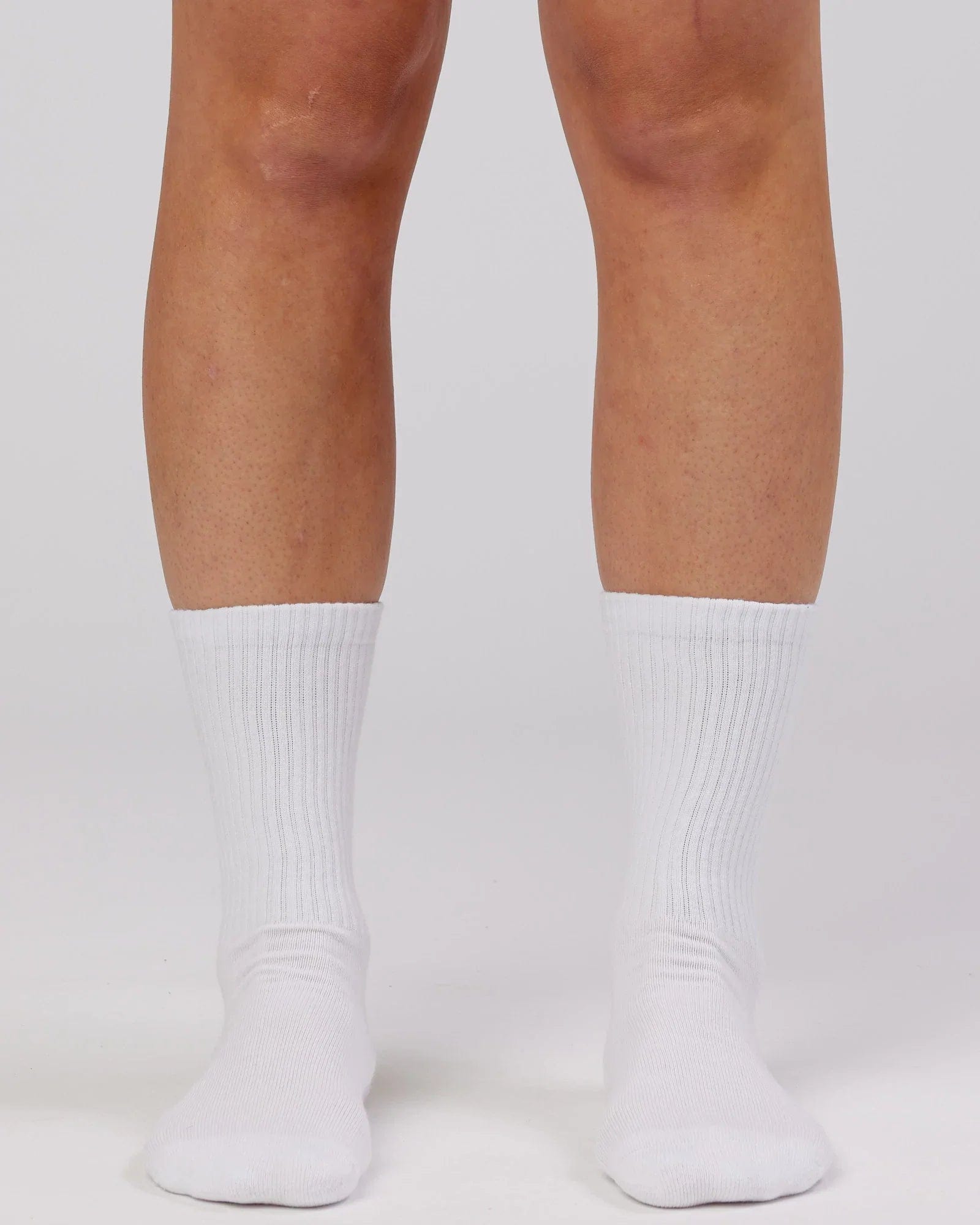 Model wearing Essential 3 Pack Crew Sock Gift - White