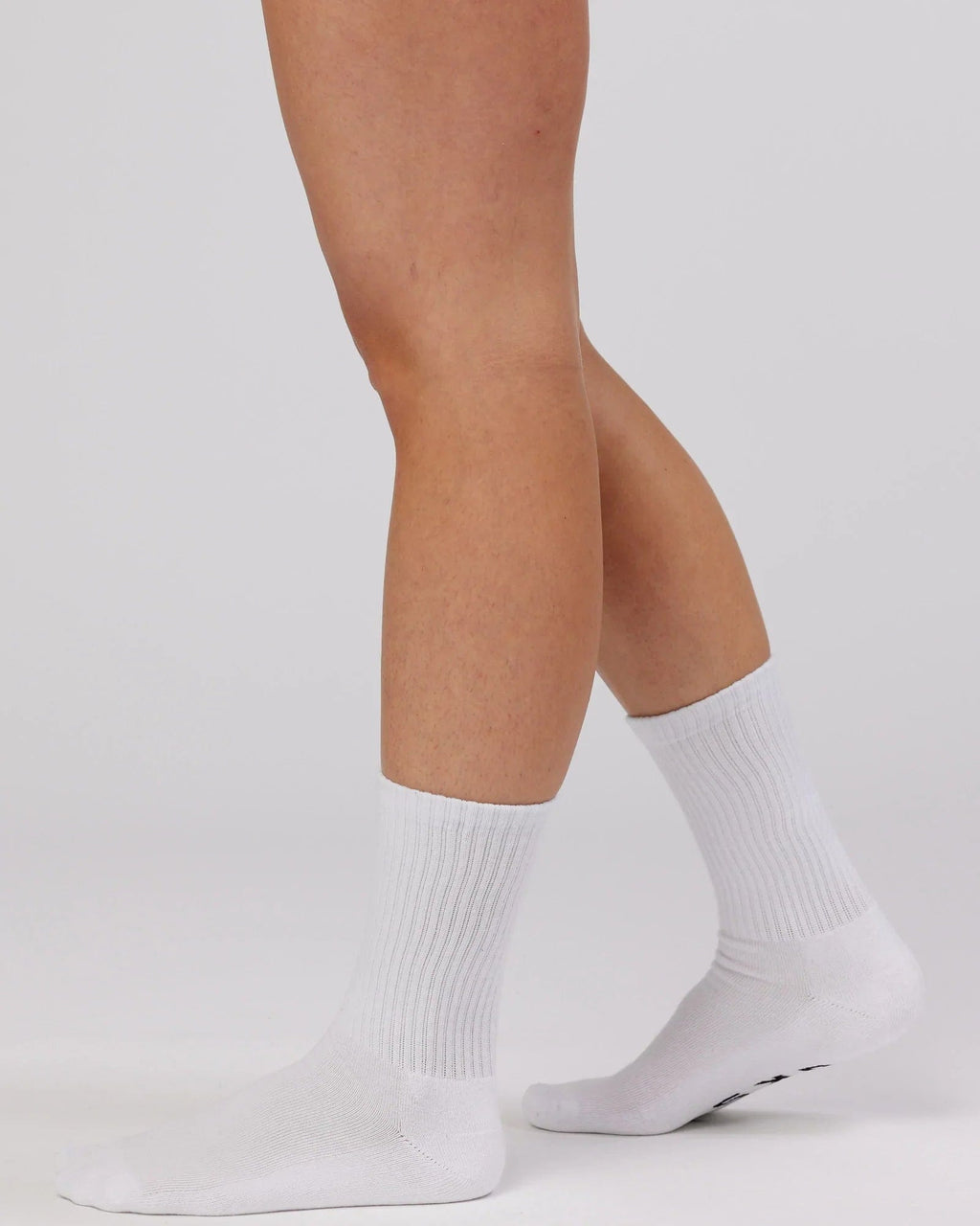 Model wearing Essential 3 Pack Crew Sock Gift - White