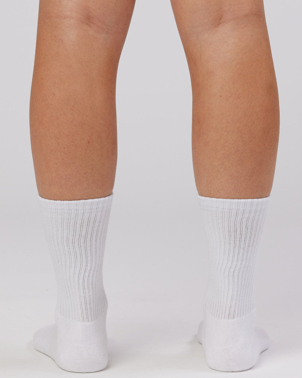 Model wearing Essential 3 Pack Crew Sock - White