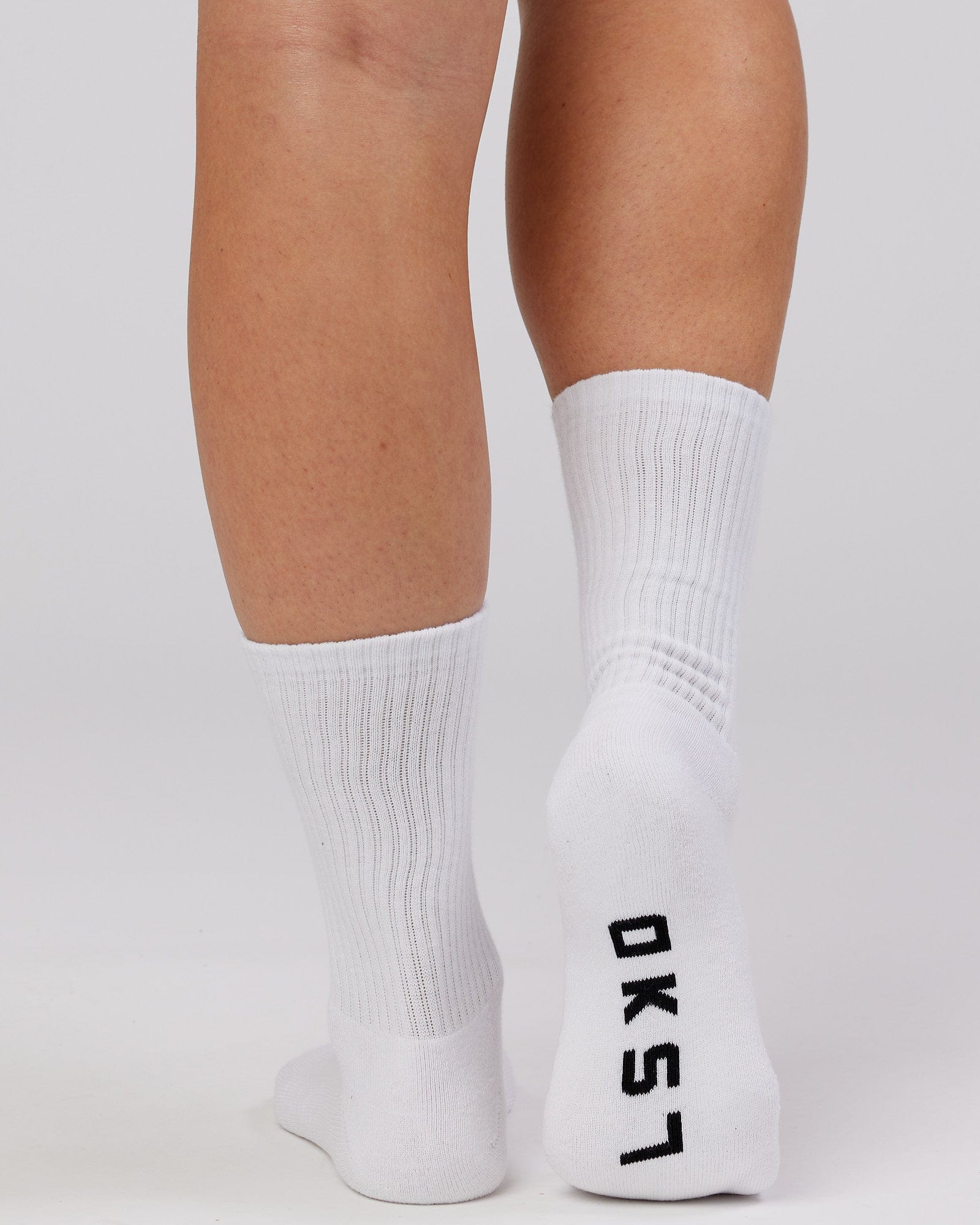 Model wearing Essential 3 Pack Crew Sock - White