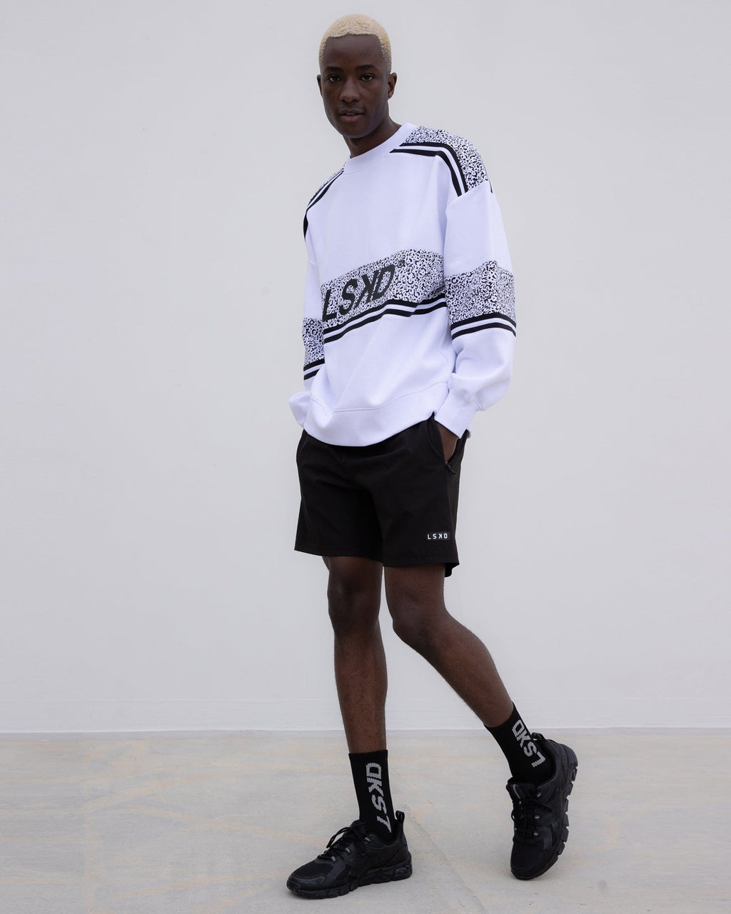 Model wearing Unisex A-Team Oversize Sweater - Spotty White-Black