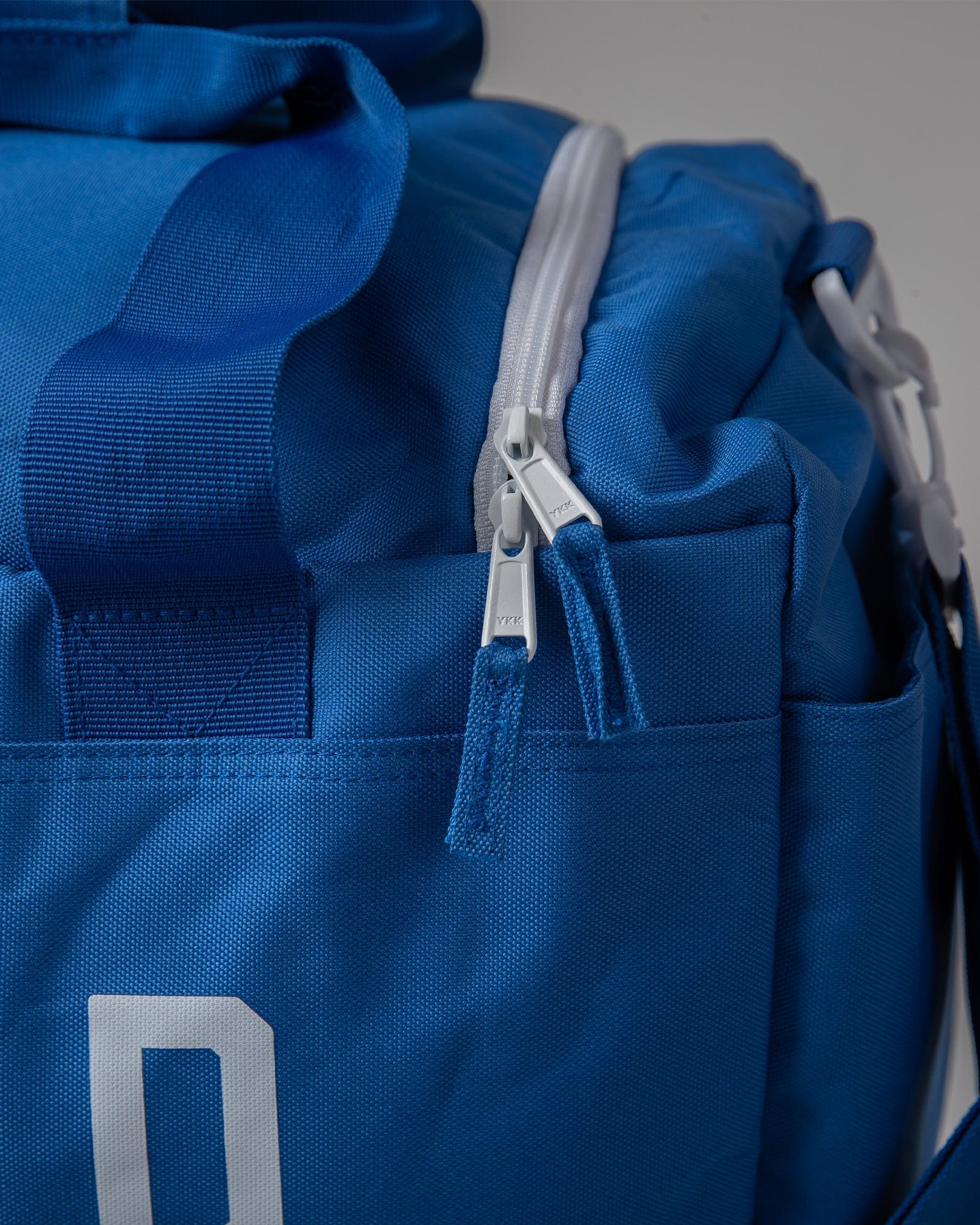 Model wearing Essential Duffle Bag - Turkish Sea