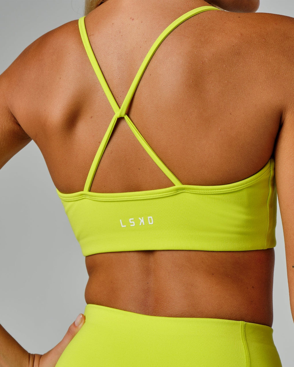 Model wearing Form Sports Bra - Fluro Lime