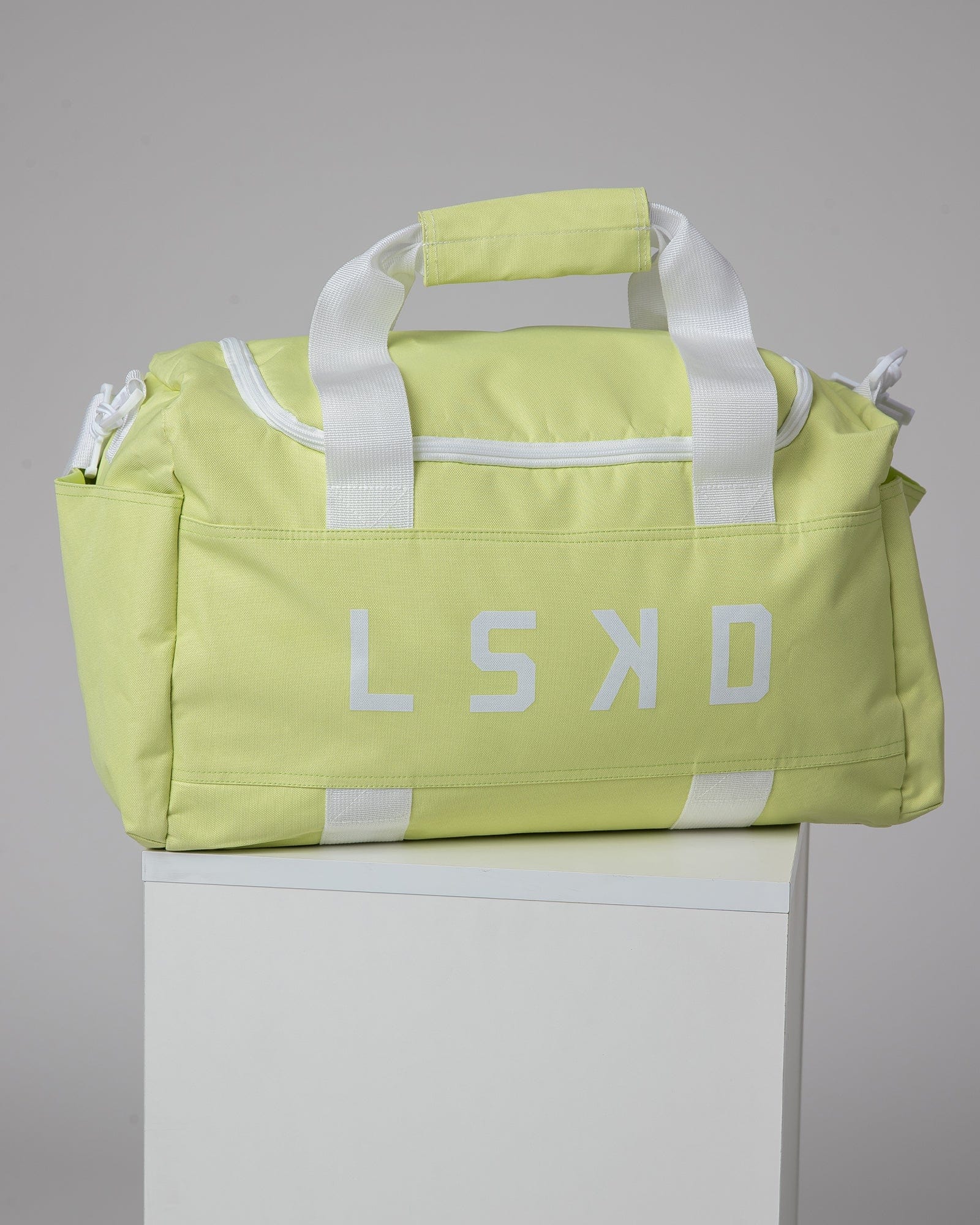 Model wearing Essential Duffle Bag - Pastel Lime