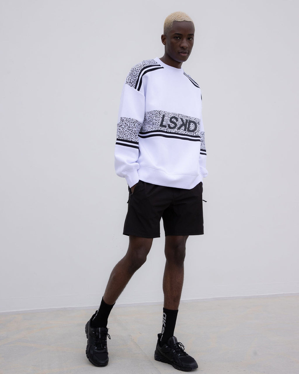 Model wearing Unisex A-Team Oversize Sweater - Spotty White-Black