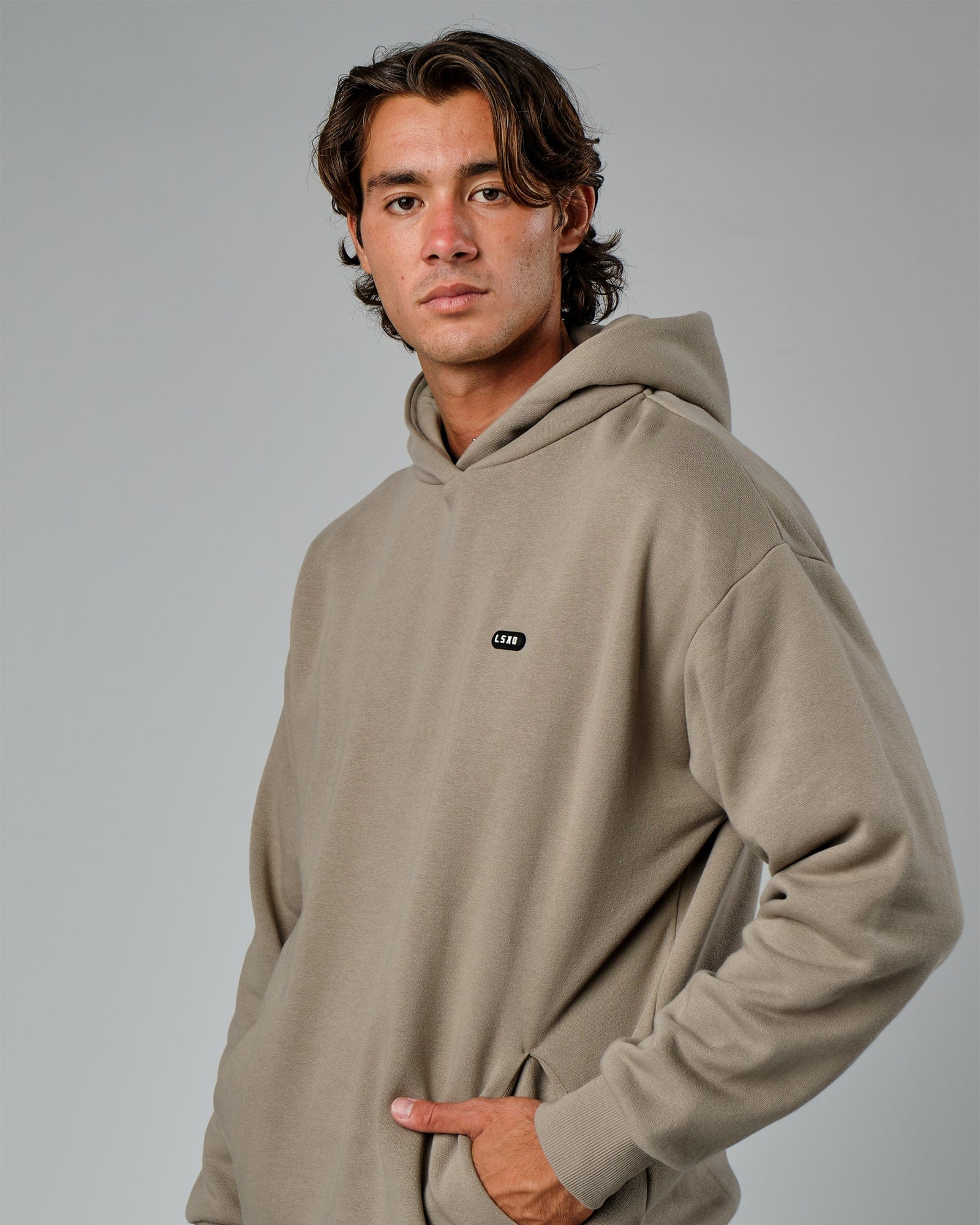 Model wearing Capsule Hoodie Oversize - Laurel Oak