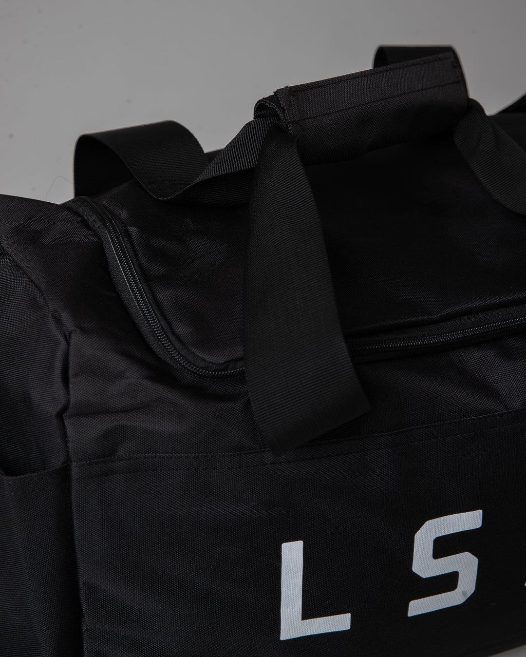 Model wearing Essential Duffle Bag Gift - Black