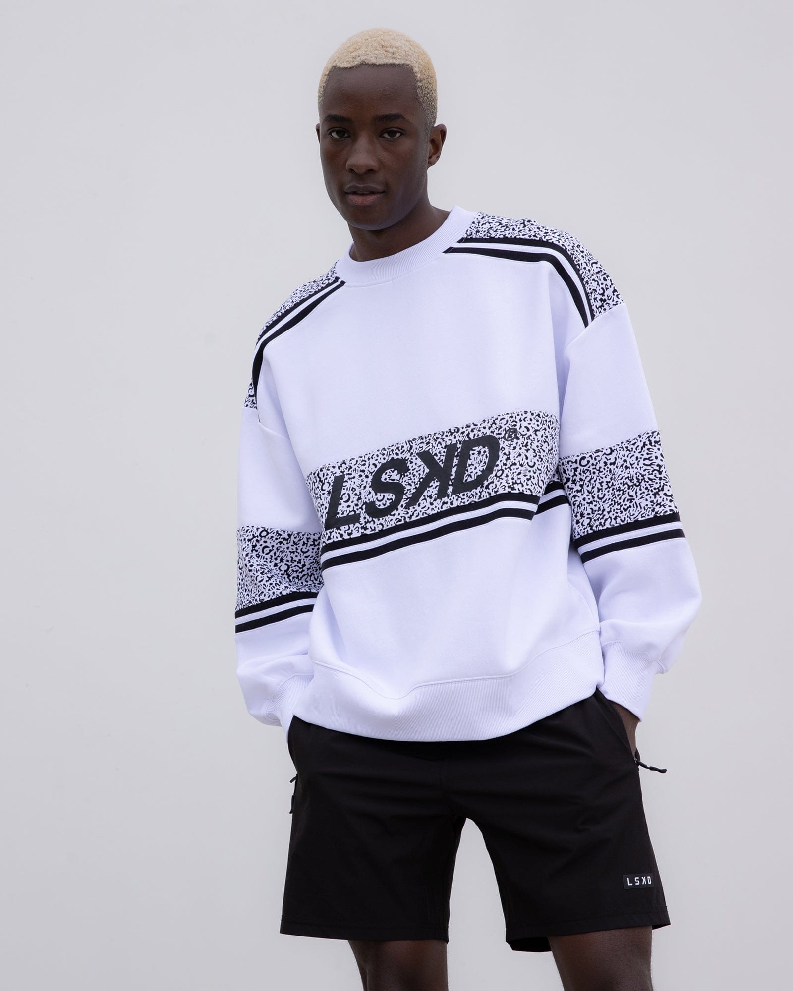 Model wearing Unisex A-Team Oversize Sweater - Spotty White-Black