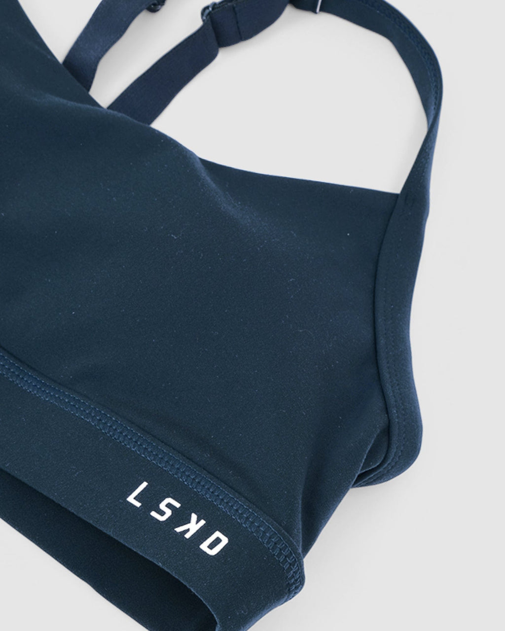 Model wearing Momentum Sports Bra - Deep Teal