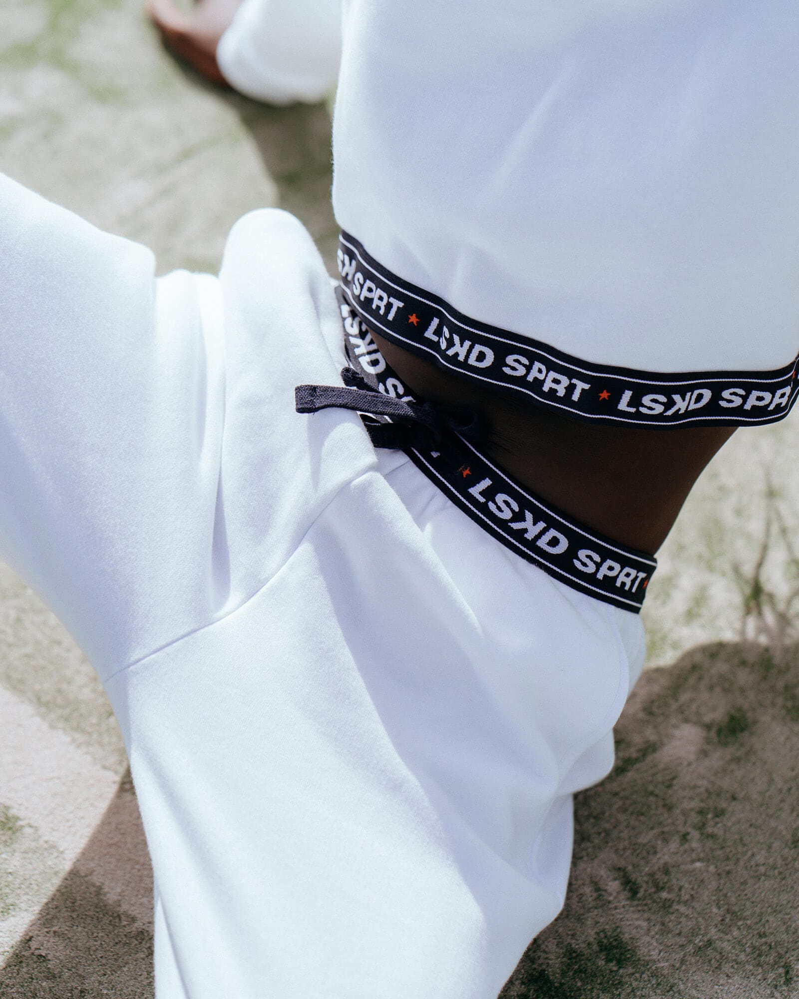 Model wearing Challenge Lounge Track Pant - White