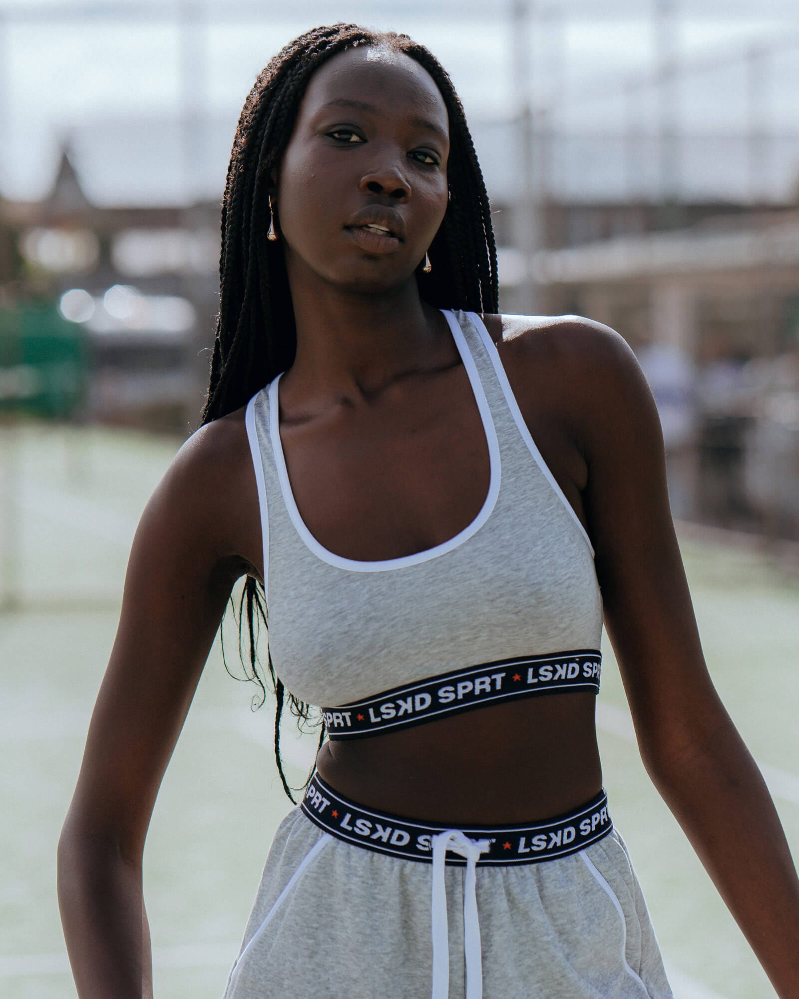 Model wearing Challenge Lounge Bra - Lt Grey Marl