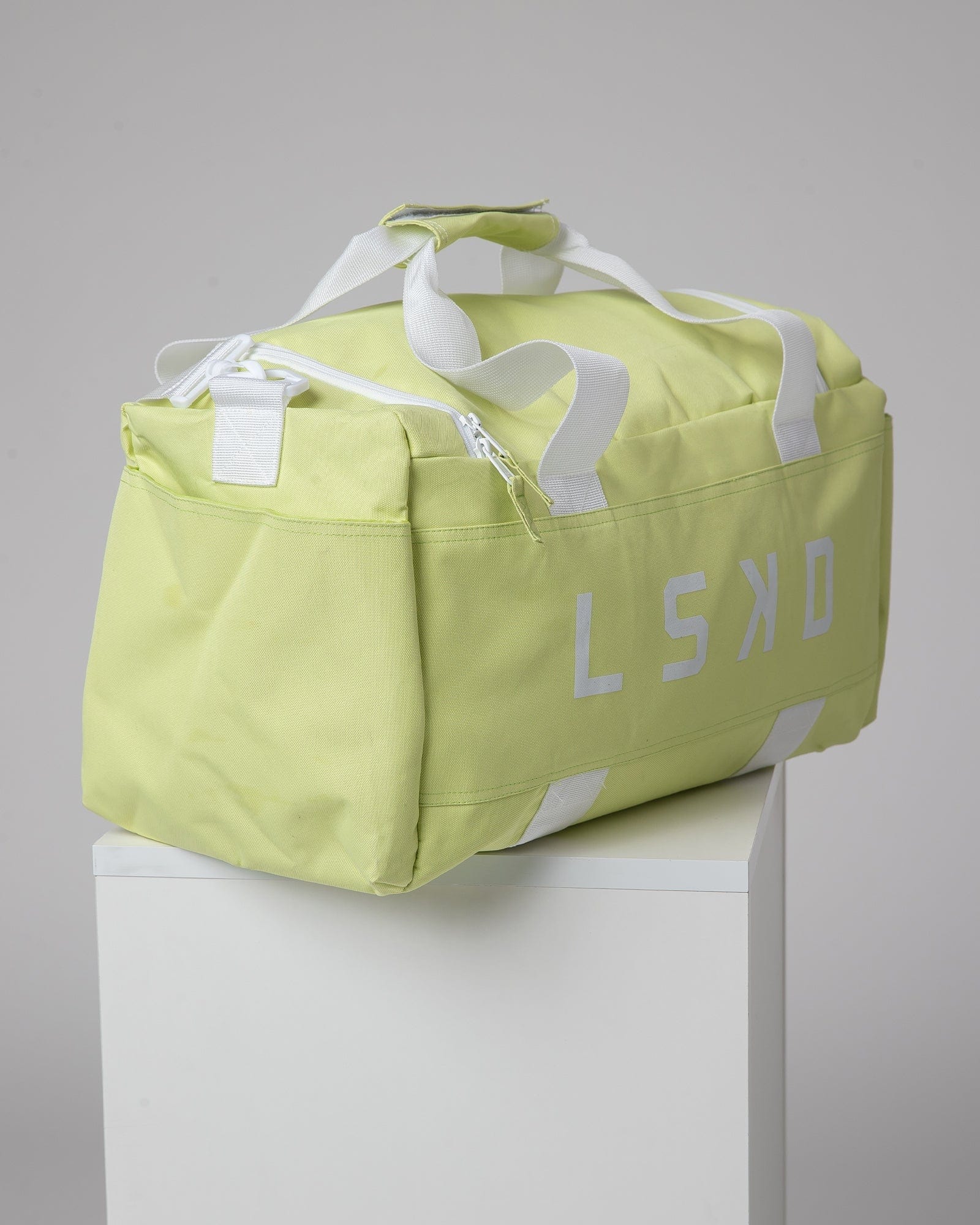 Model wearing Essential Duffle Bag - Pastel Lime