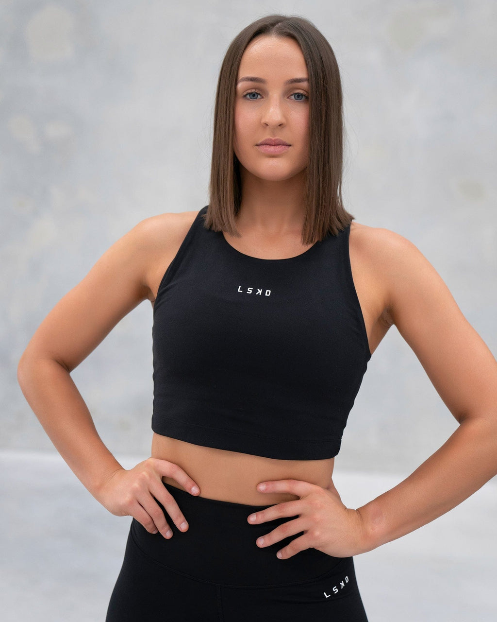 Model wearing Base Crop Tank - Black