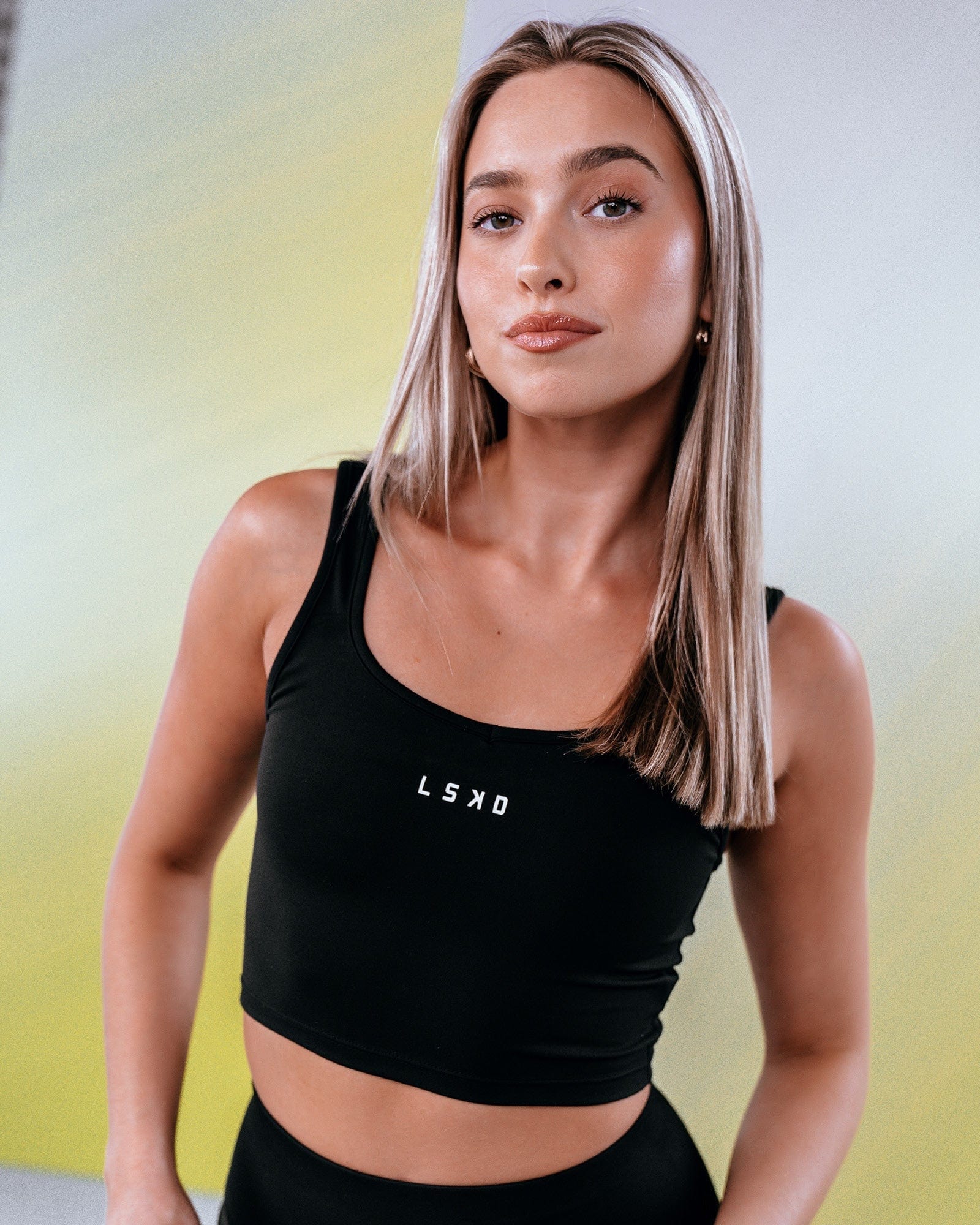 Model wearing Knockout Active Tank - Black