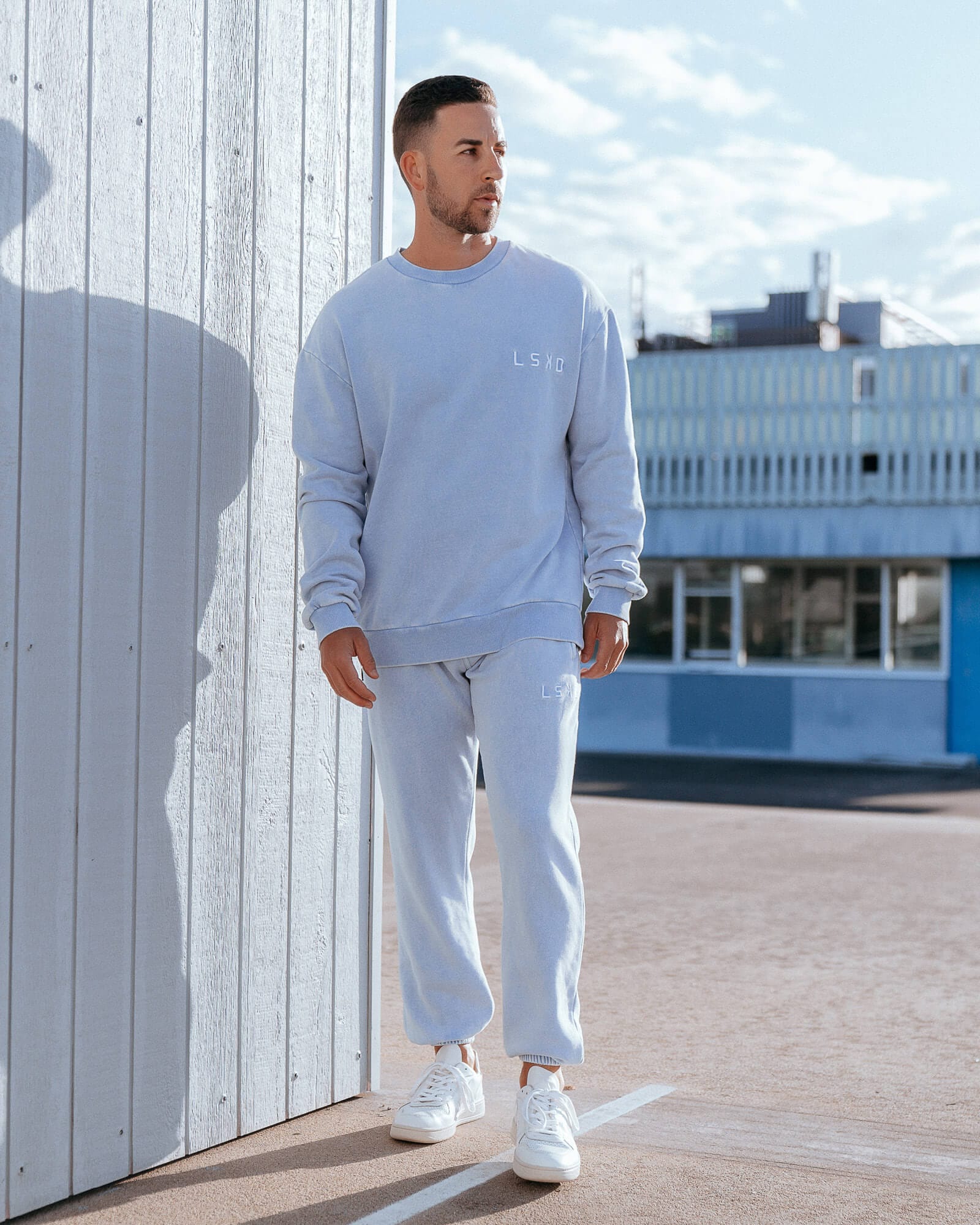 Model wearing Essential Track Pant - Pilled Pigment Blue