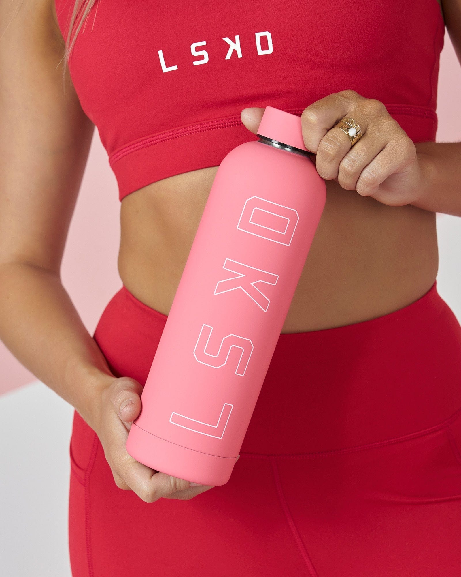 Model wearing Tidy Bottle - Peony Pink