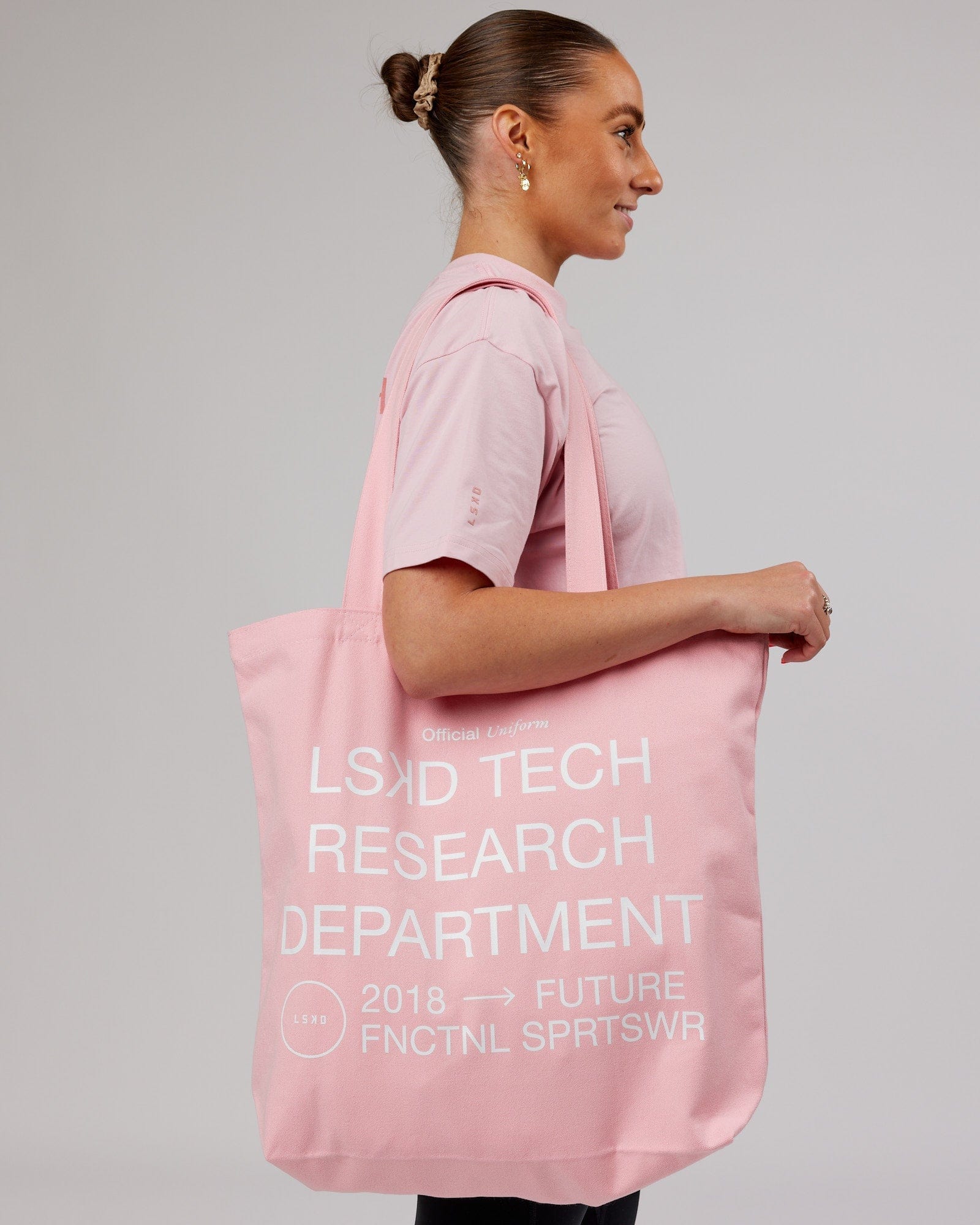 Model wearing LTRD Oversized Tote Bag - Pink Frosting