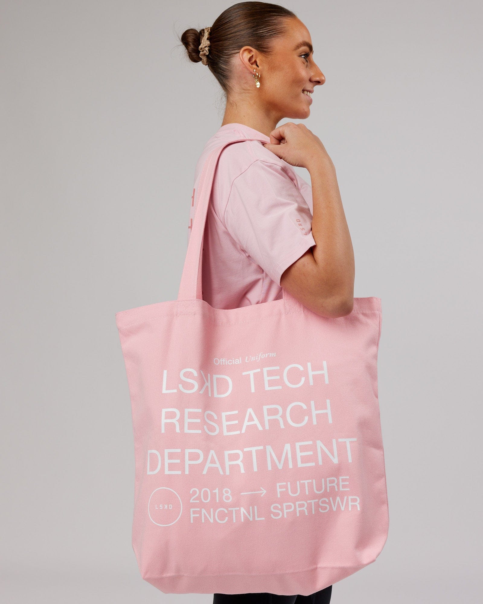 Model wearing LTRD Oversized Tote Bag - Pink Frosting