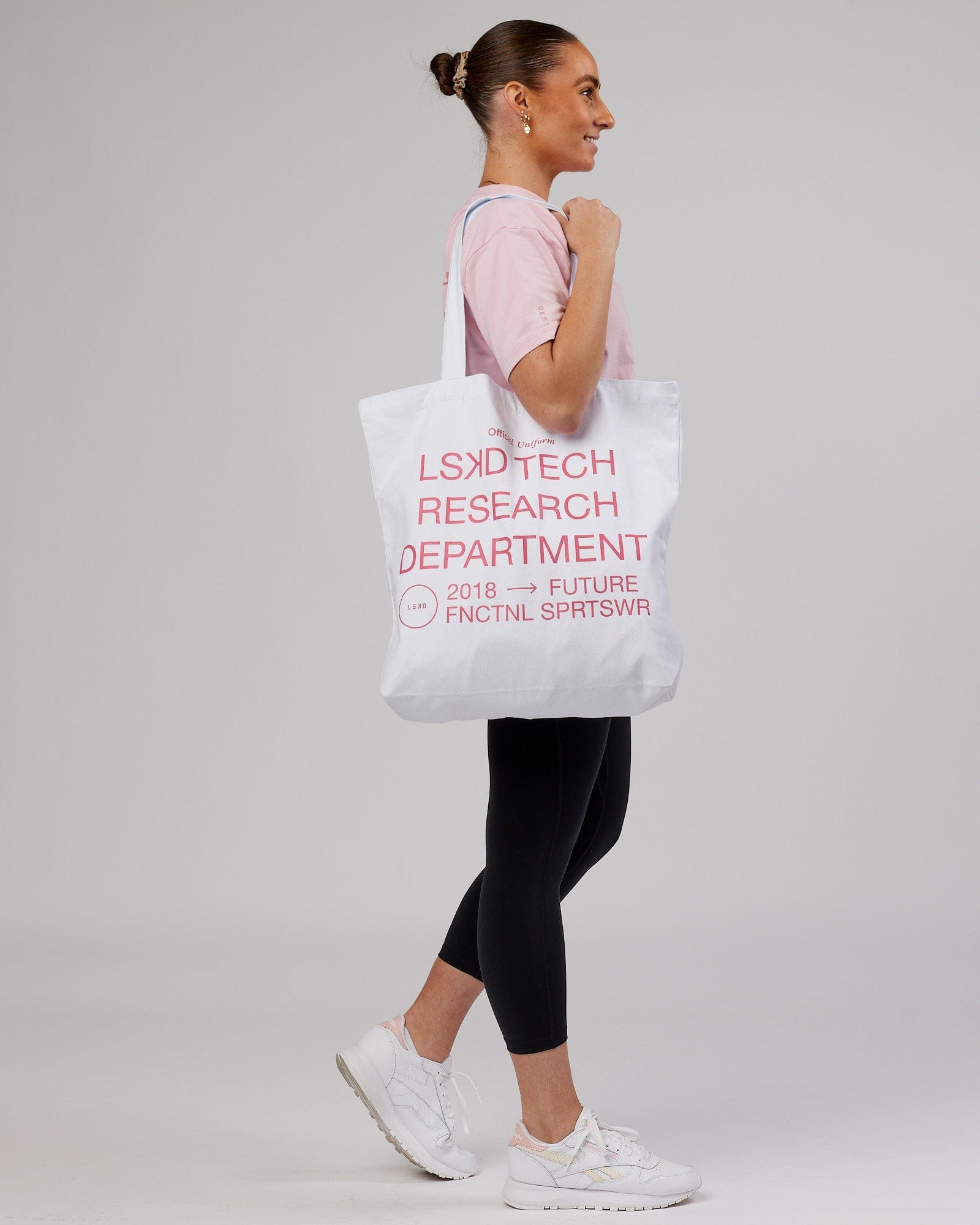 Model wearing LTRD Oversized Tote Bag - White-Pink Frosting