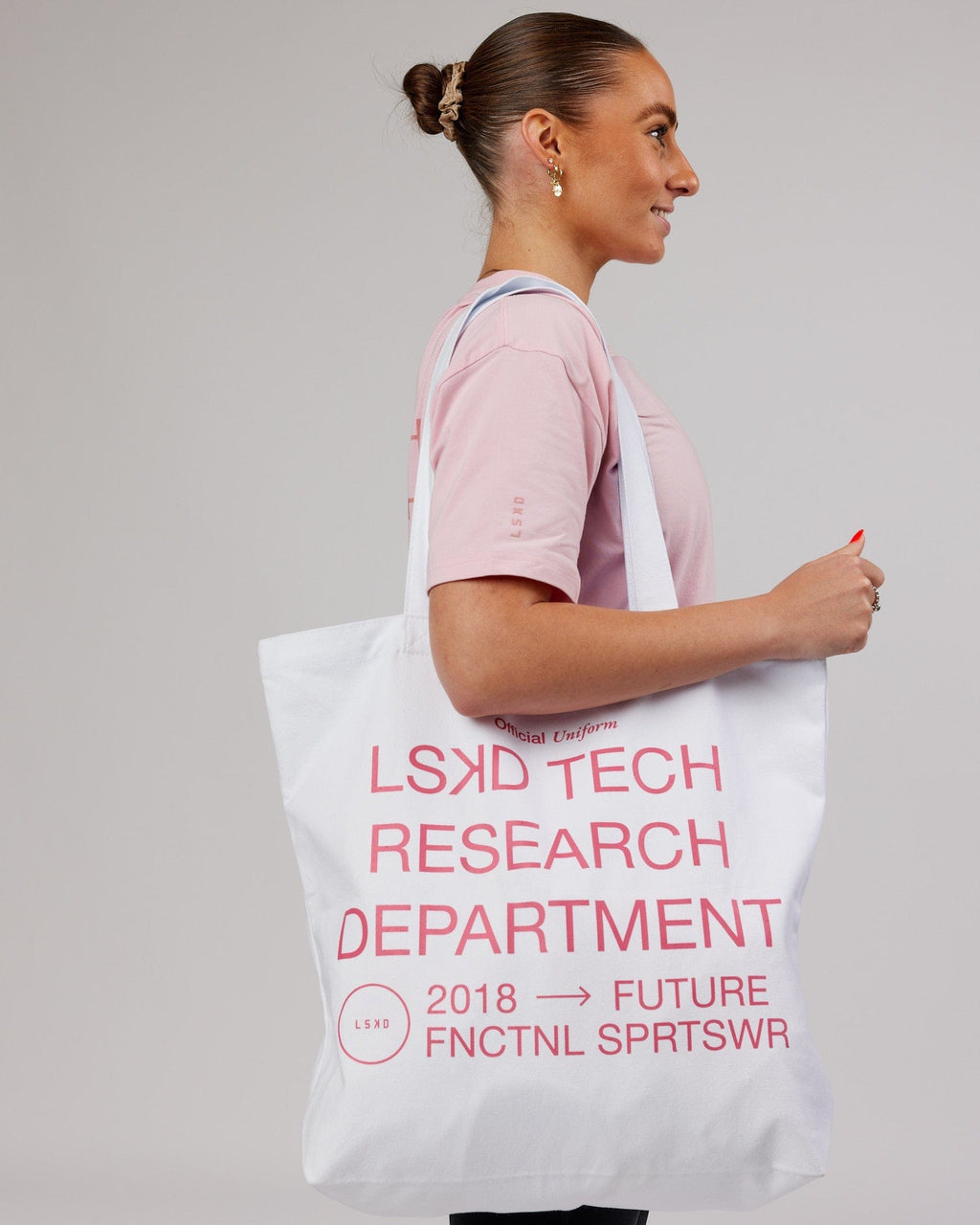 Model wearing LTRD Oversized Tote Bag - White-Pink Frosting