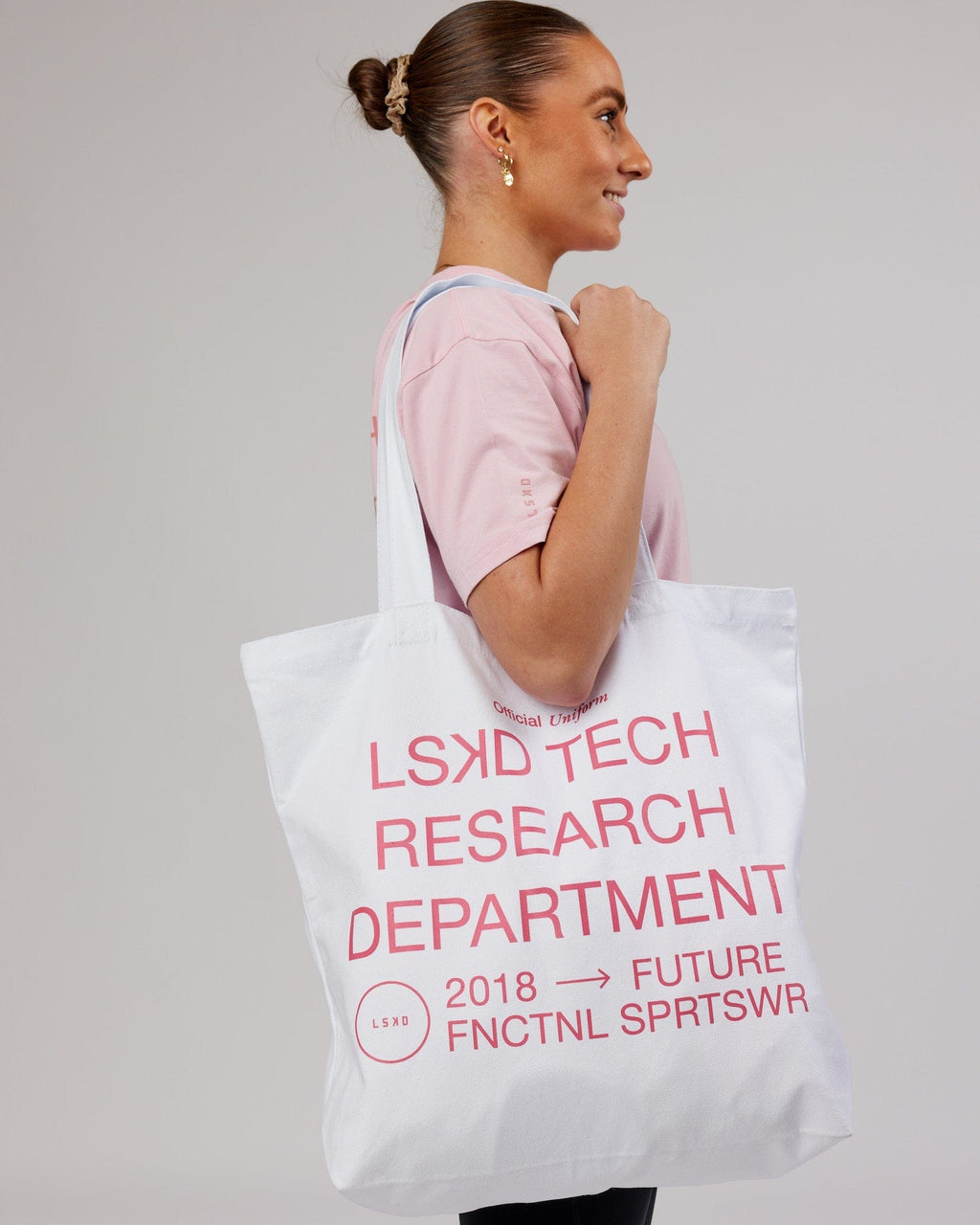 Model wearing LTRD Oversized Tote Bag - White-Pink Frosting