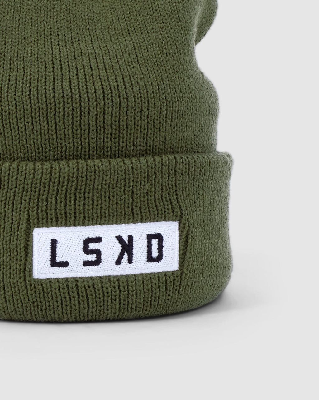 Model wearing Cornerstone Beanie - Army Green