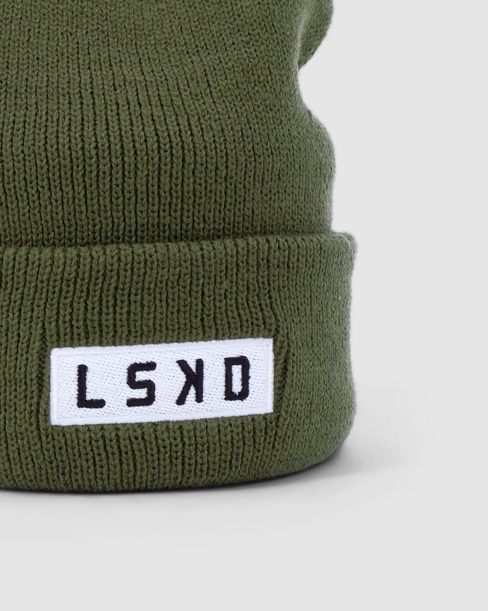 Model wearing Cornerstone Beanie - Army Green