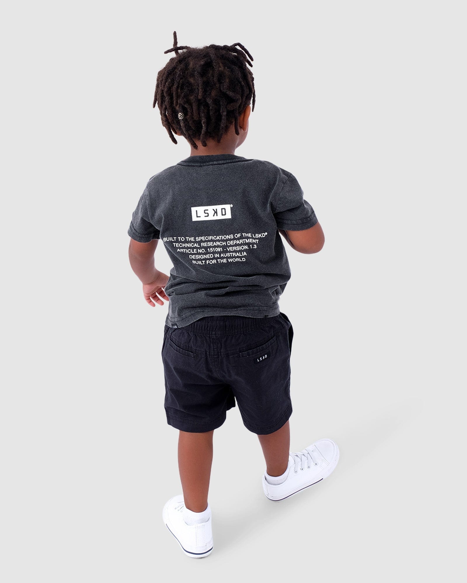 Model wearing Instruction Tee (00-6) - Pilled Pigment Black