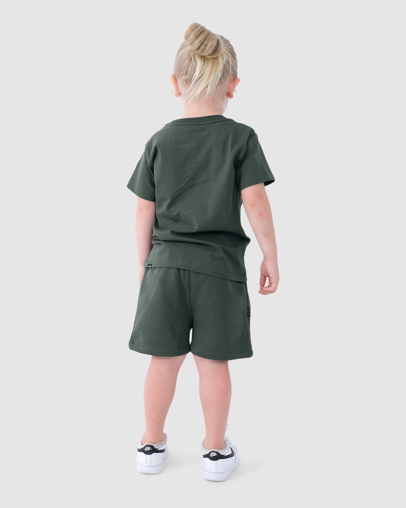 Model wearing Essential Track Shorts (00-8) - Carbon Green