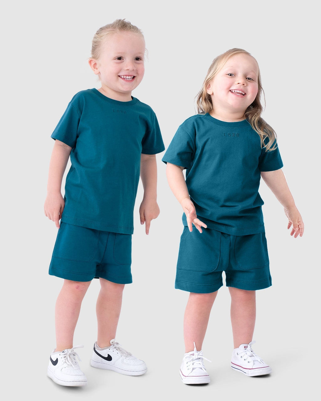 Model wearing Field Tee (00-8) - Blue Coral