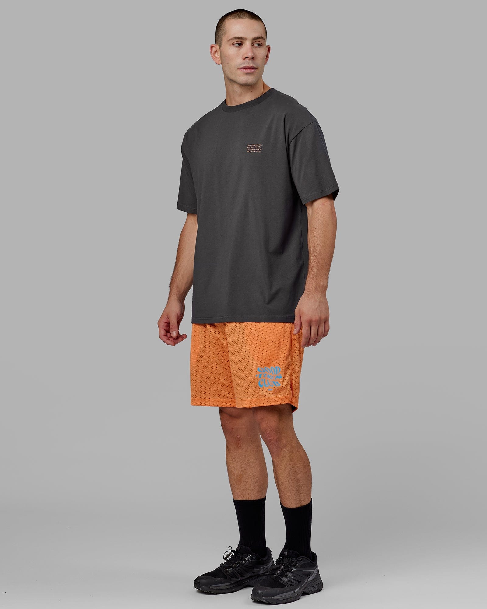 Model wearing Hyper Reversible Basketball Short - Black-Tangerine