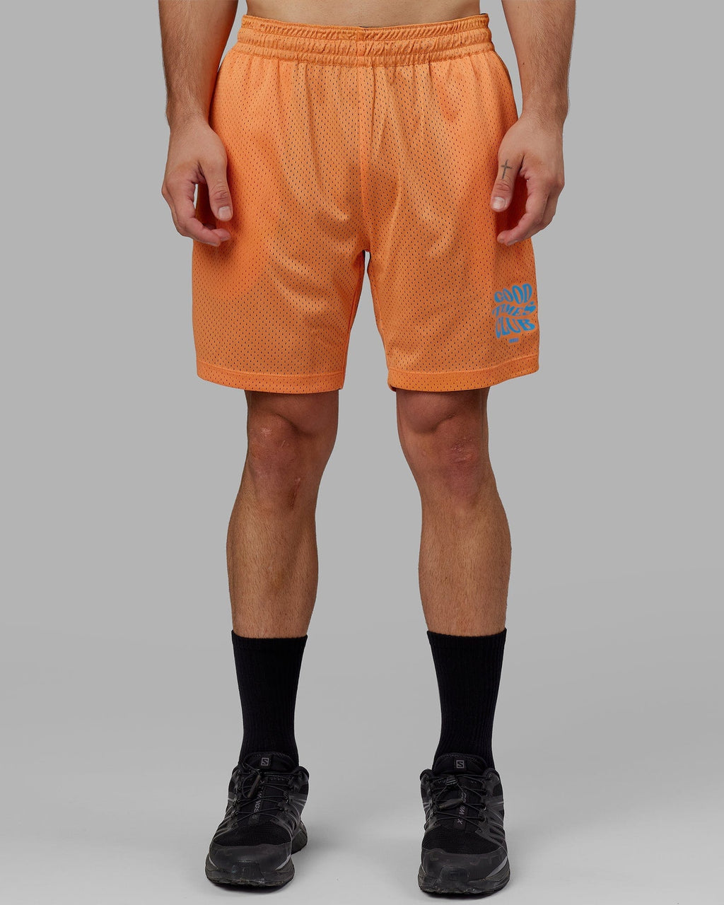 Model wearing Hyper Reversible Basketball Short - Black-Tangerine