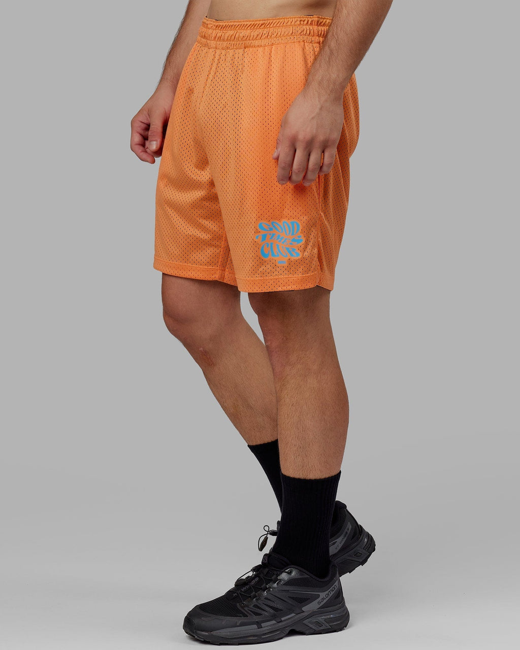 Model wearing Hyper Reversible Basketball Short - Black-Tangerine