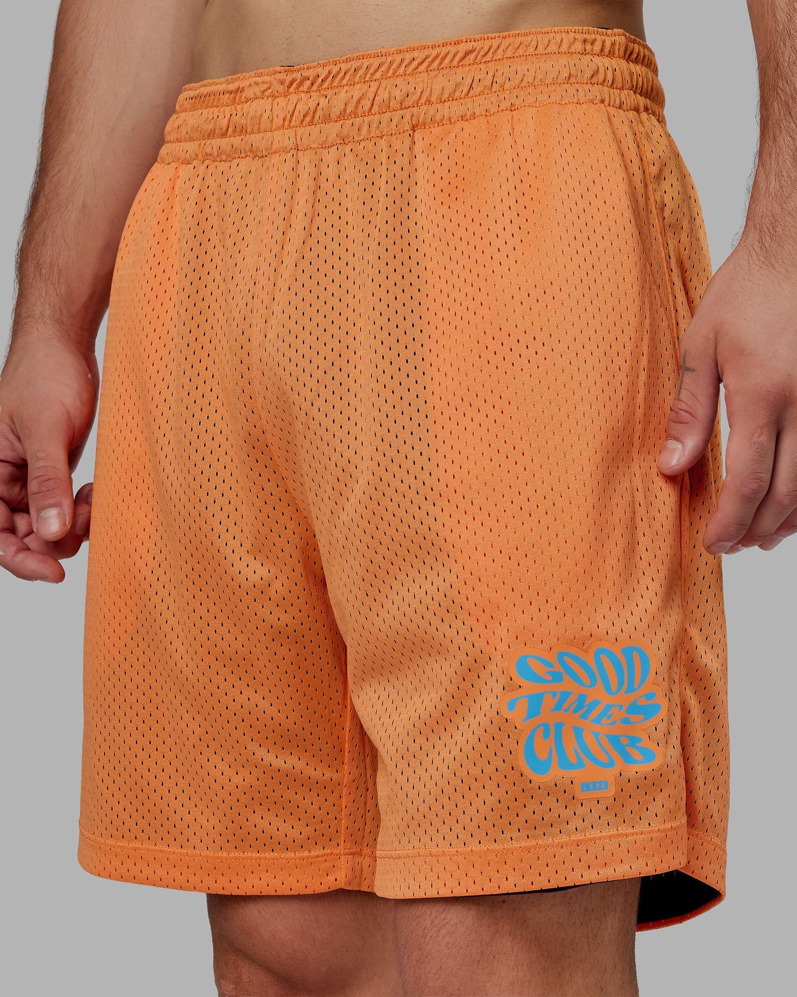 Model wearing Hyper Reversible Basketball Short - Black-Tangerine
