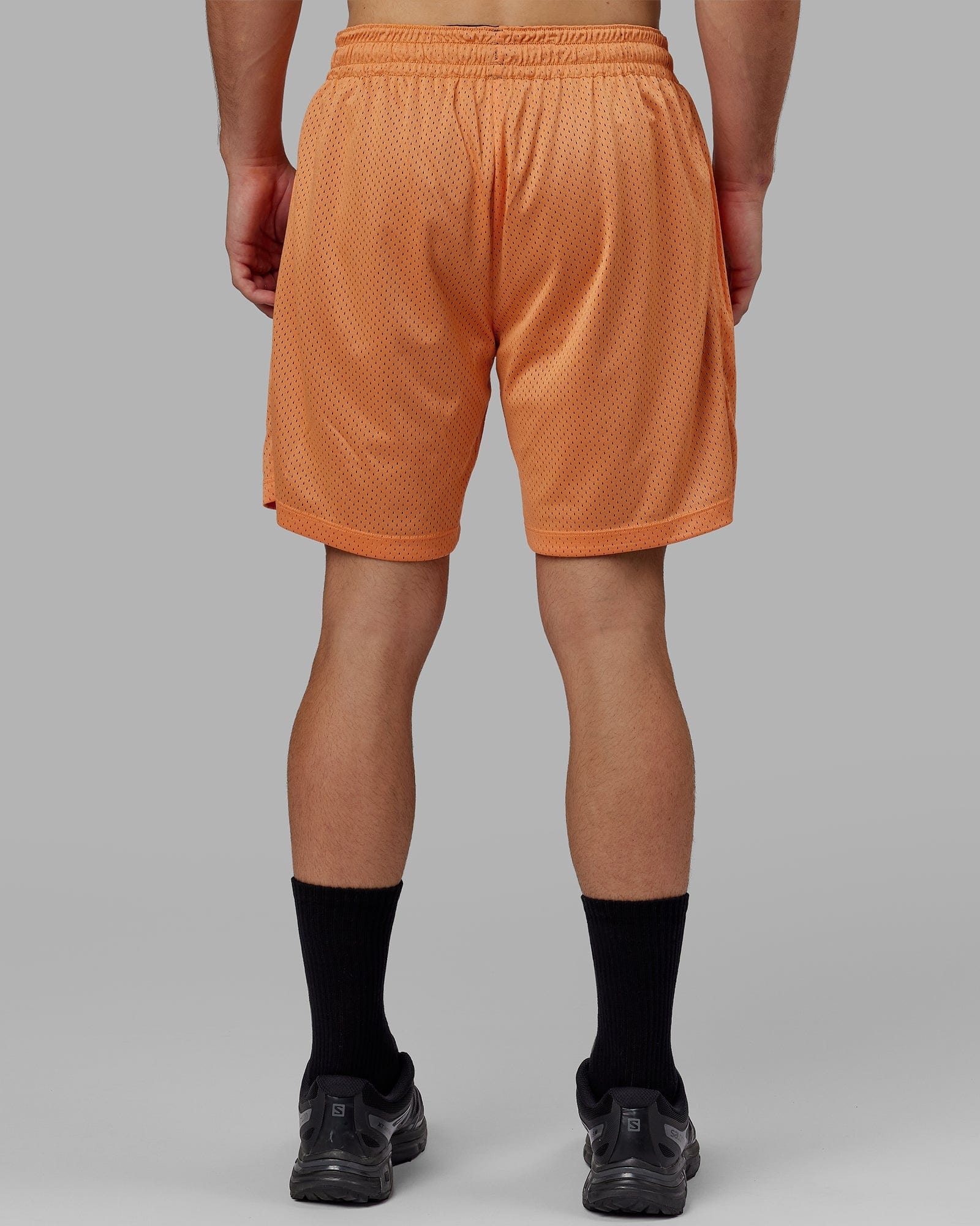 Model wearing Hyper Reversible Basketball Short - Black-Tangerine