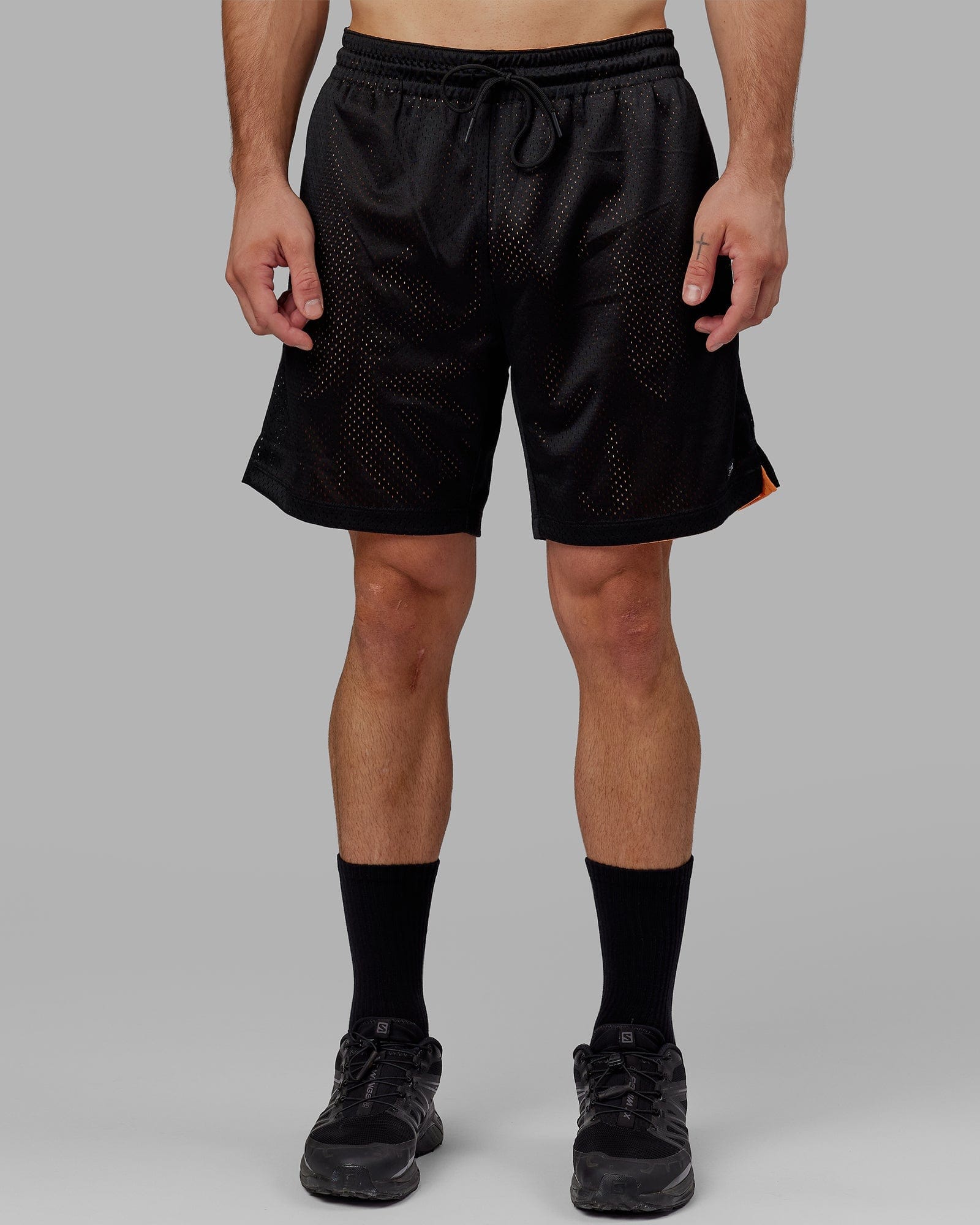 Model wearing Hyper Reversible Basketball Short - Black-Tangerine