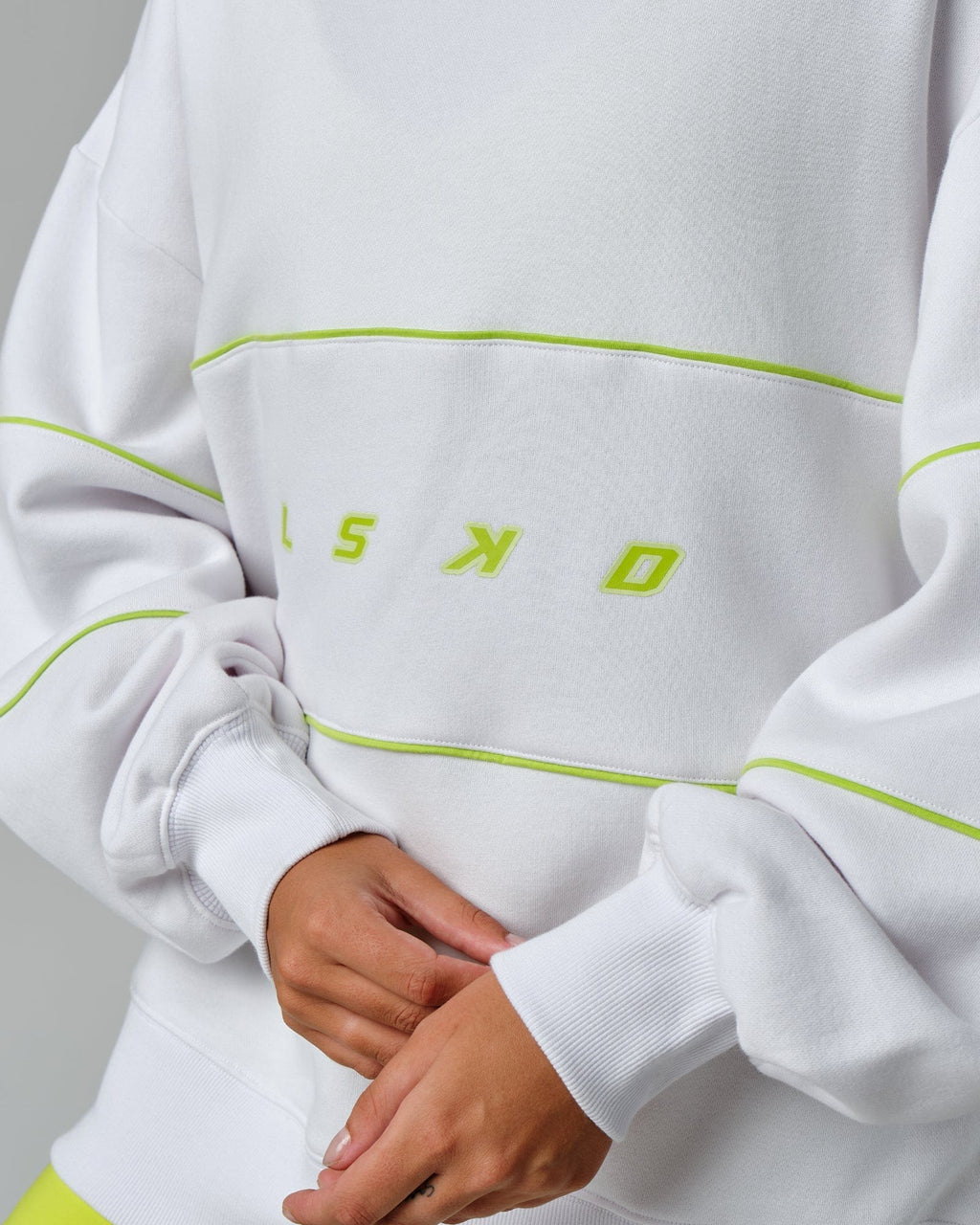Model wearing Unisex Ascent Oversized Sweater - White-Fluro Lime