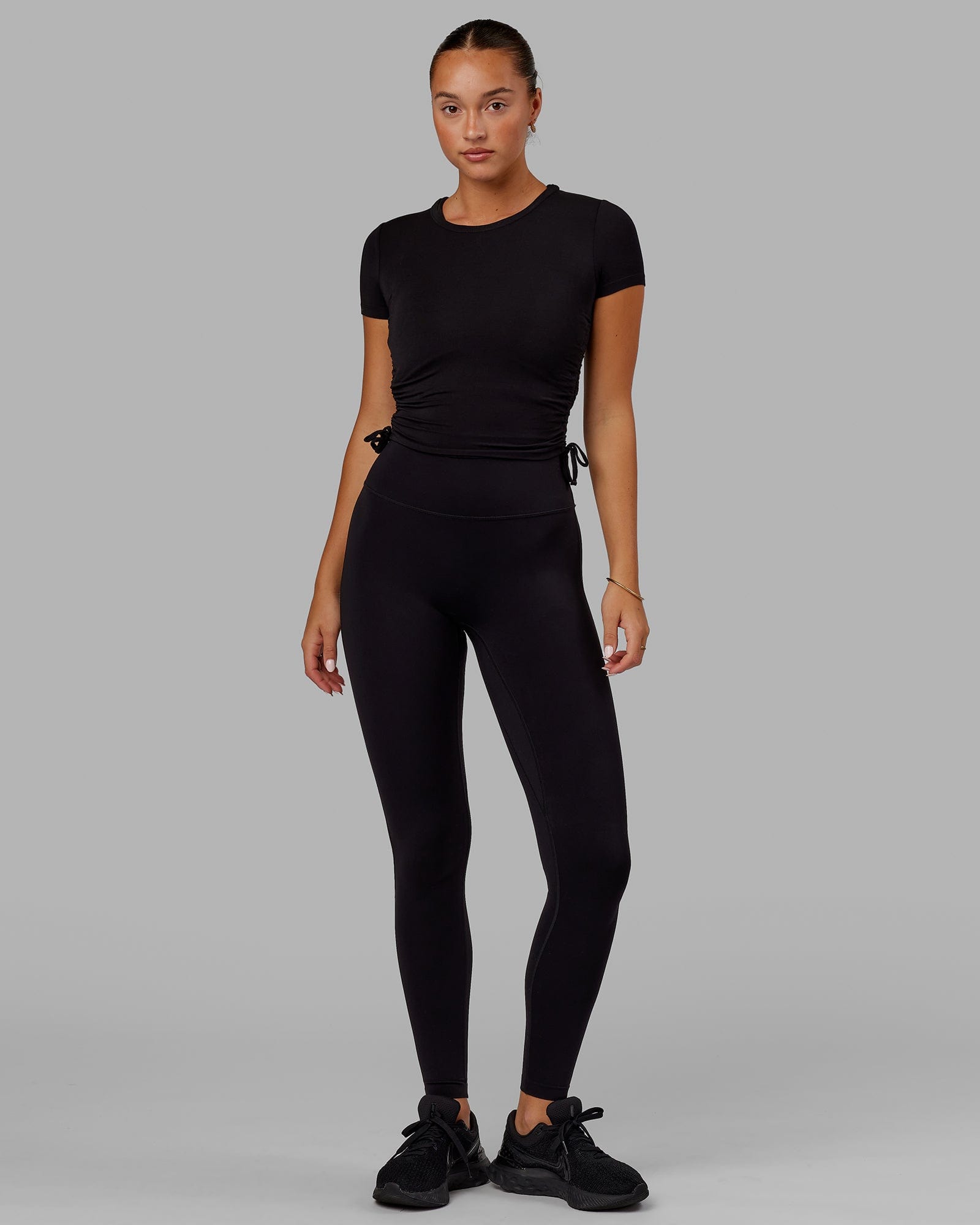 Model wearing Kick On Cropped Tee - Black