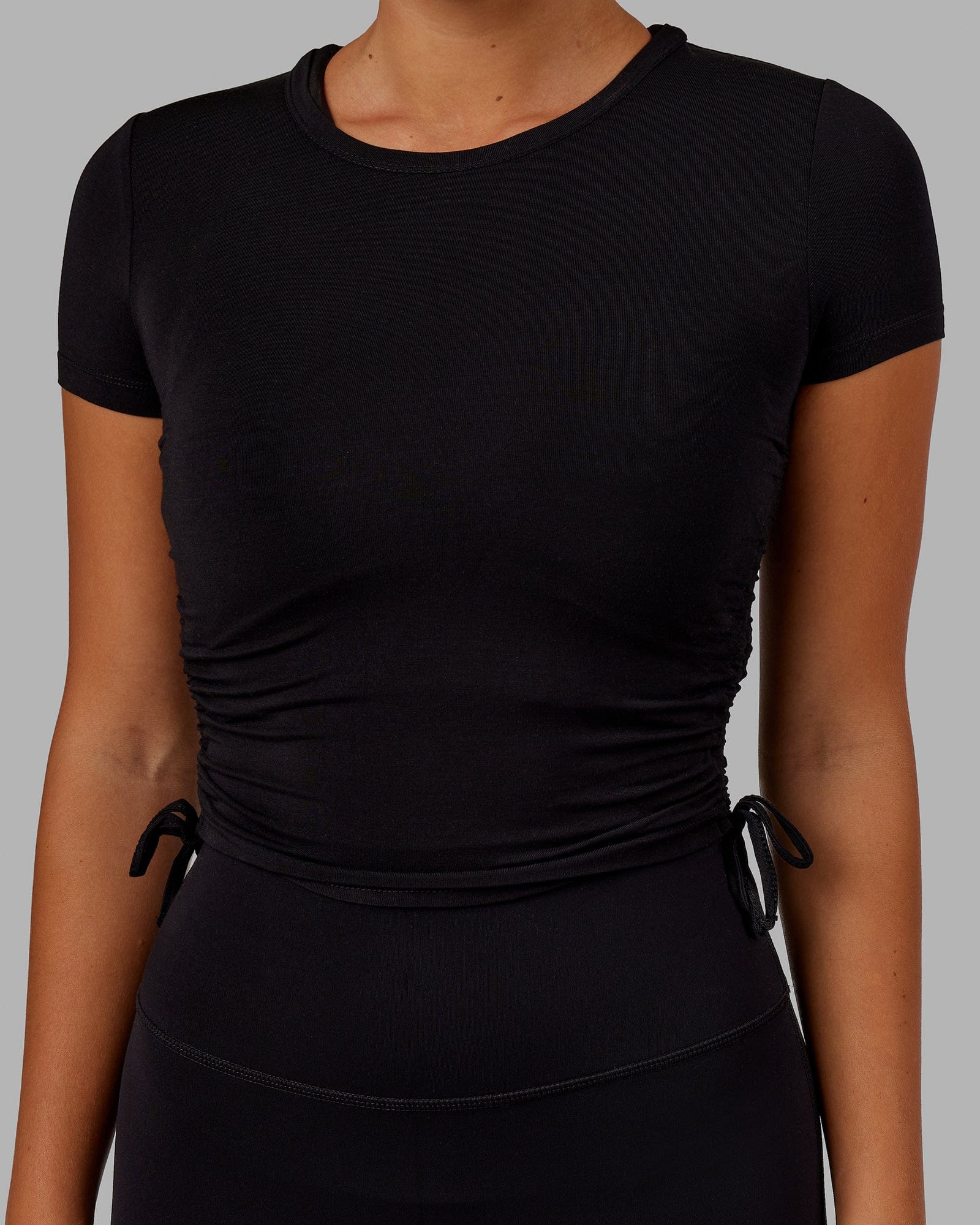 Model wearing Kick On Cropped Tee - Black