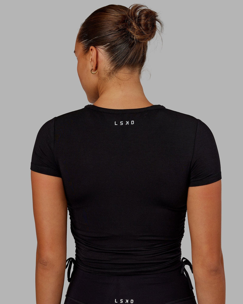 Model wearing Kick On Cropped Tee - Black