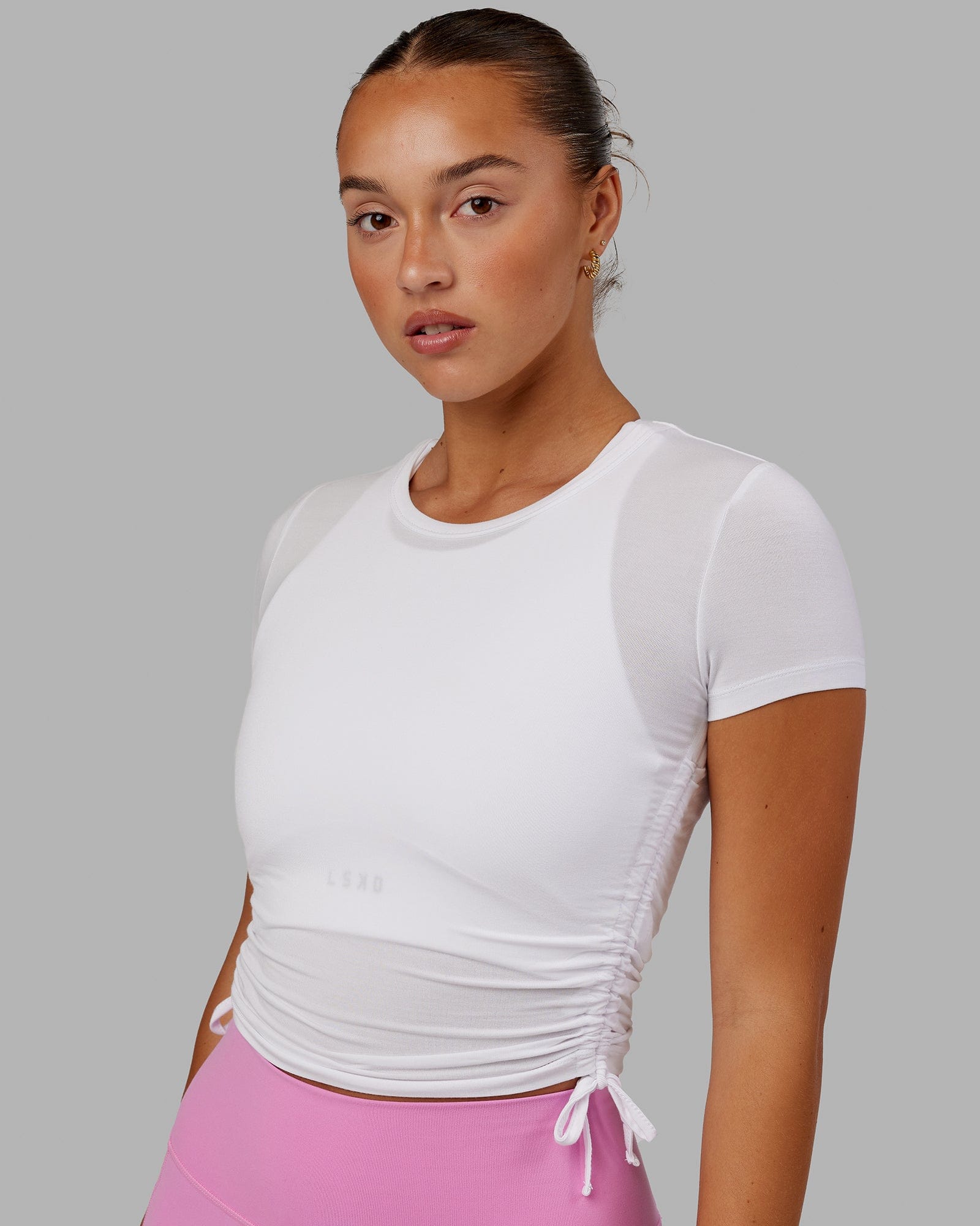 Model wearing Kick On Cropped Tee - White