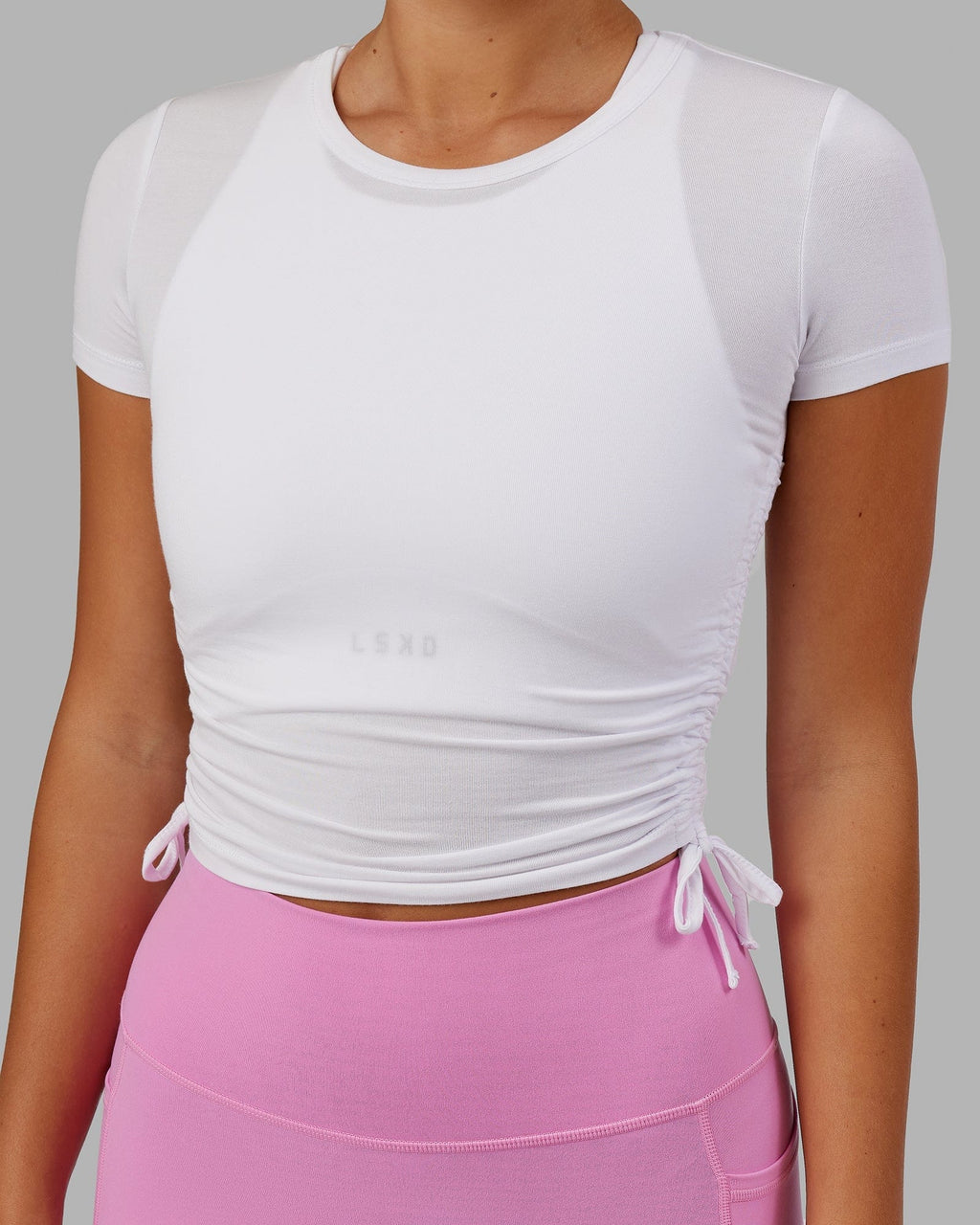 Model wearing Kick On Cropped Tee - White