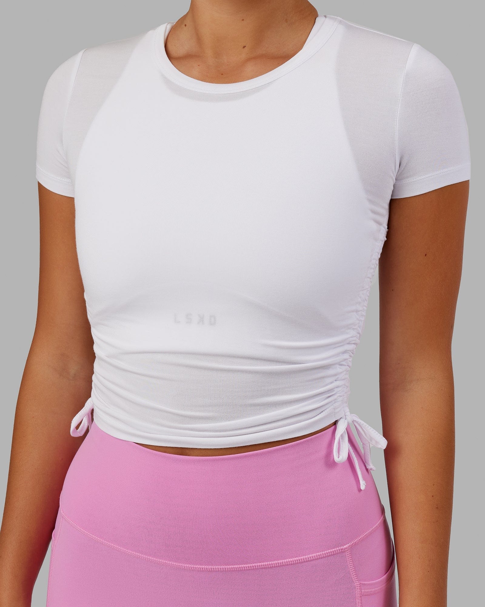 Model wearing Kick On Cropped Tee - White