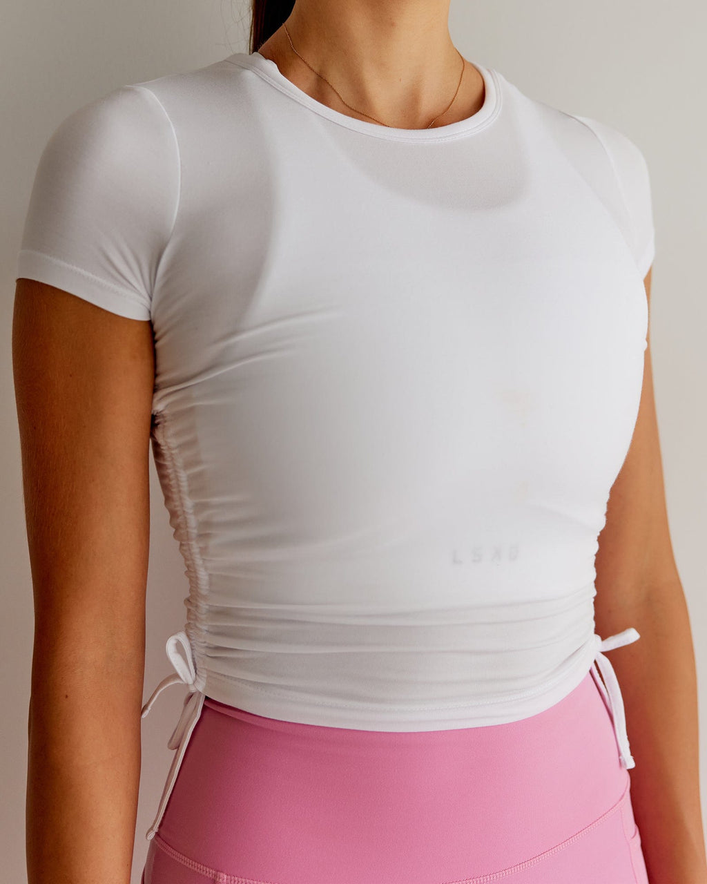 Model wearing Kick On Cropped Tee - White