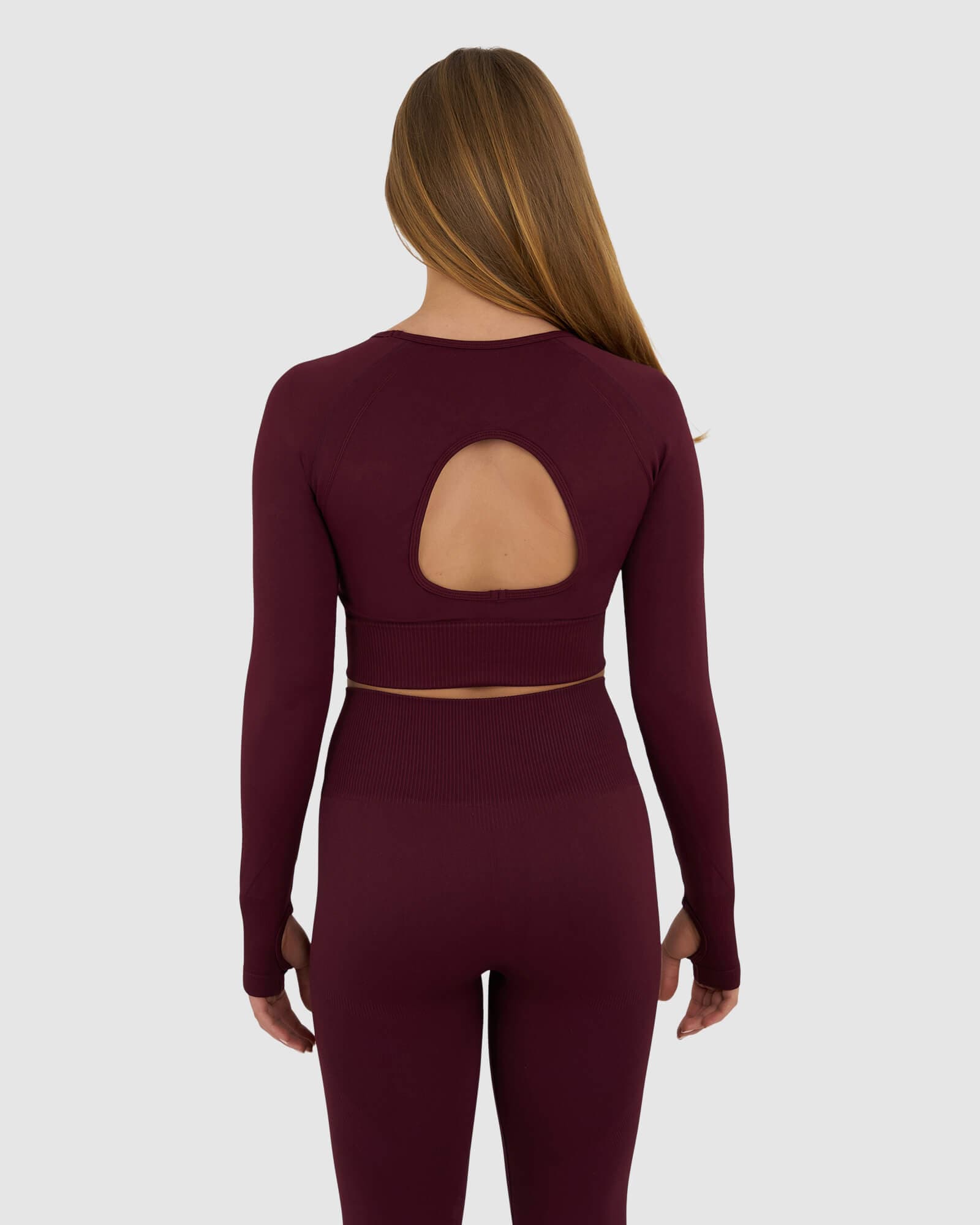 Model wearing Seamless LS Top - Wine