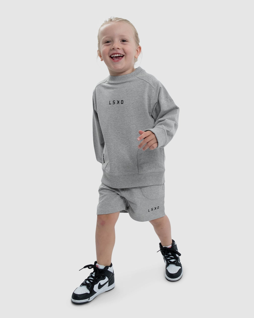 Model wearing Routine Track Short (00-8) - Lt Grey Marl