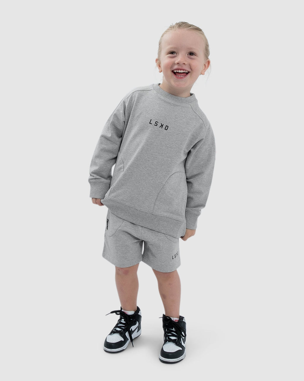 Model wearing Routine Sweater (00-8) - Lt Grey Marl