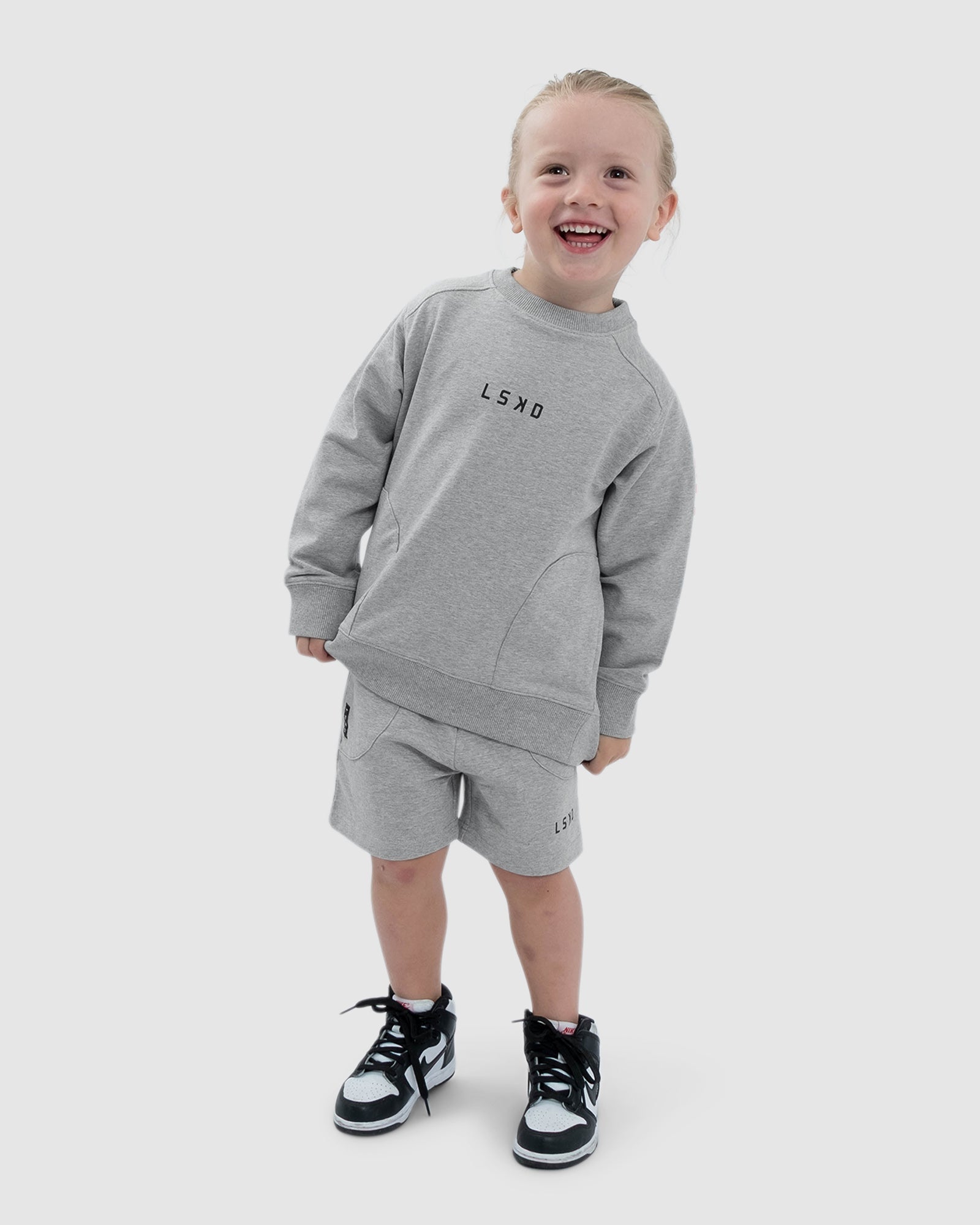 Model wearing Routine Sweater (00-8) - Lt Grey Marl