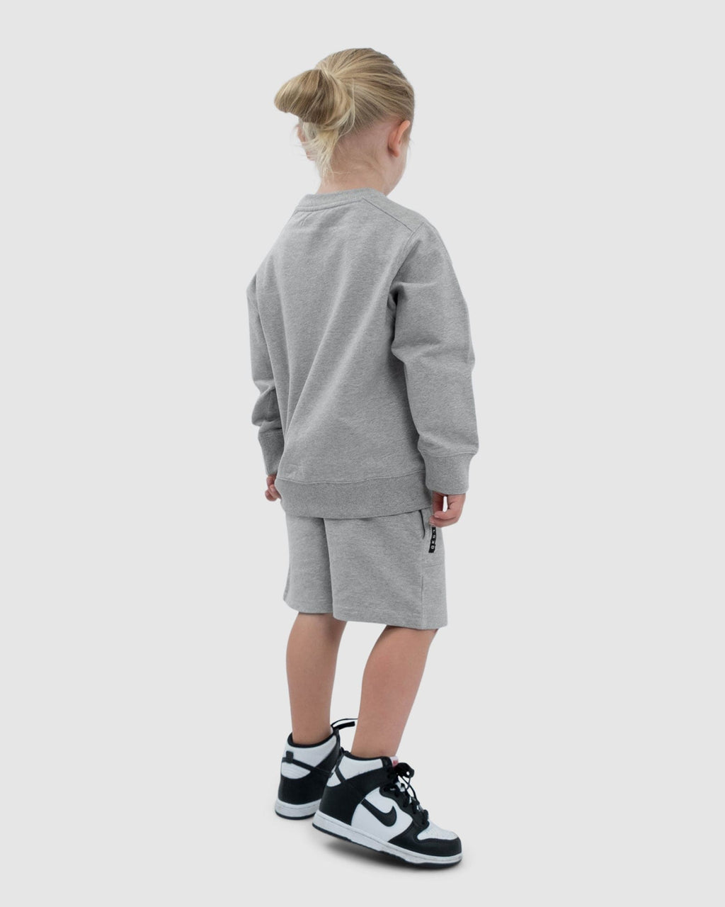 Model wearing Routine Track Short (00-8) - Lt Grey Marl